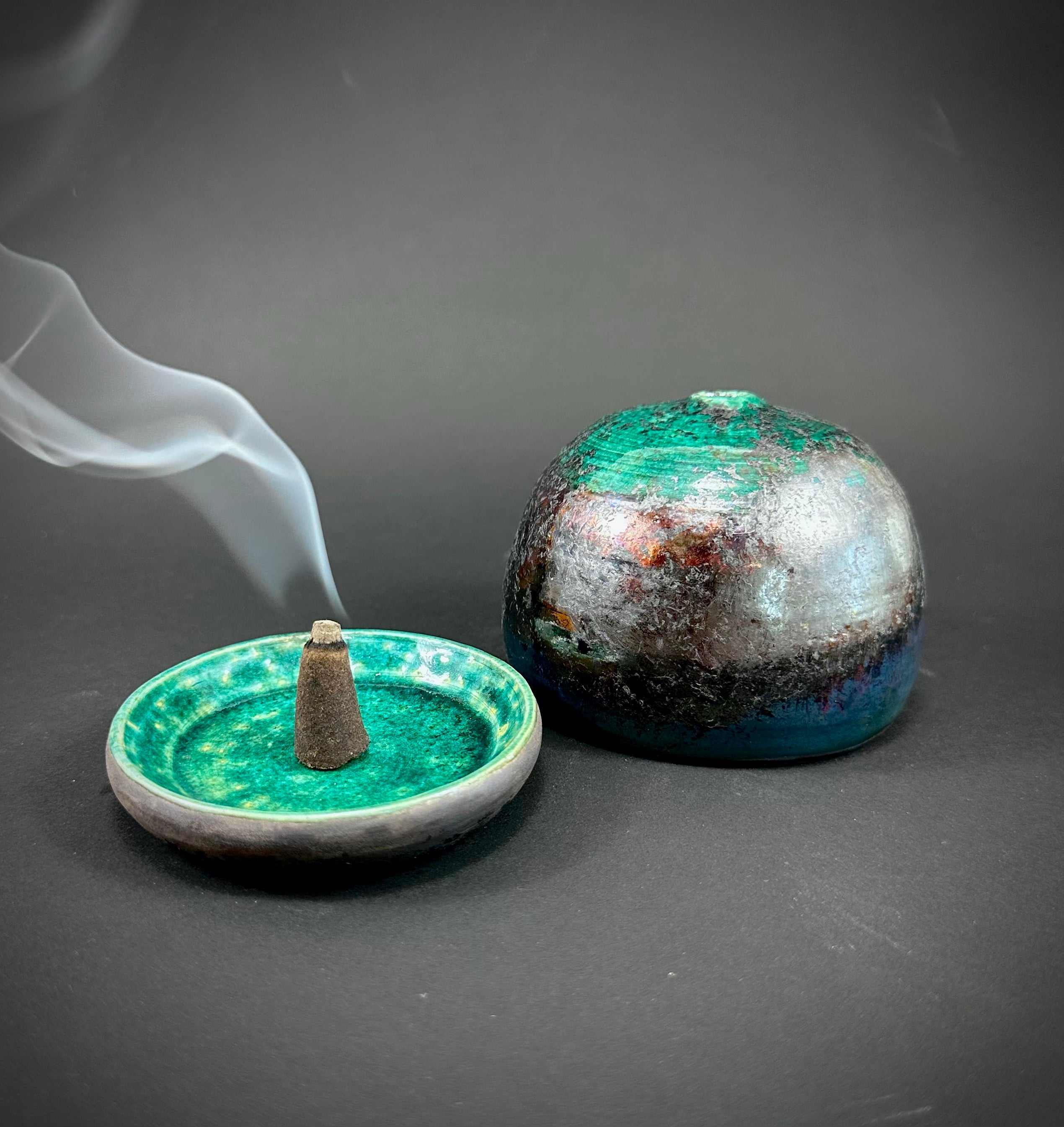 A Raku fired incense dome in a beautiful copper green glaze