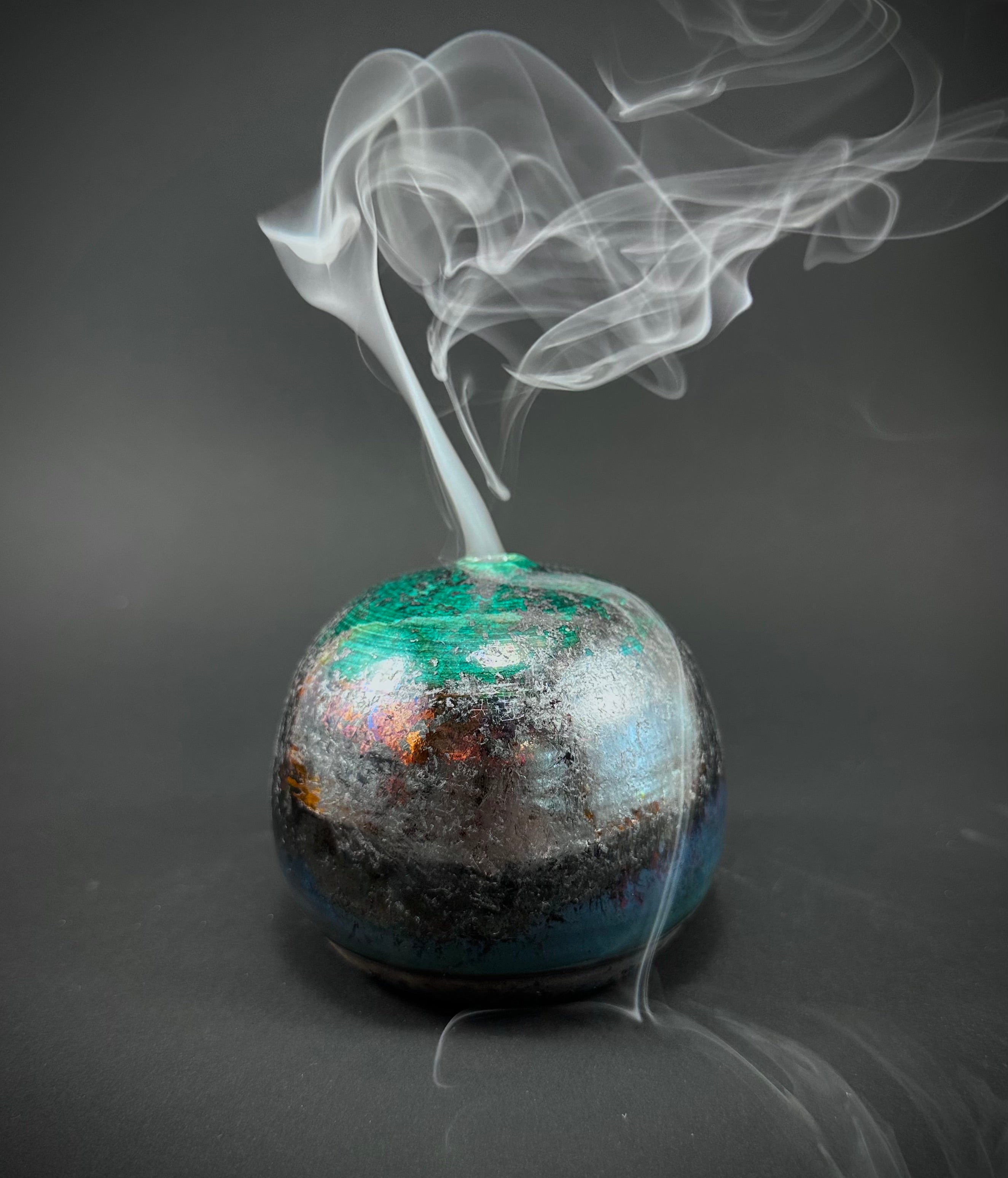 A Raku fired incense dome in a beautiful copper green glaze