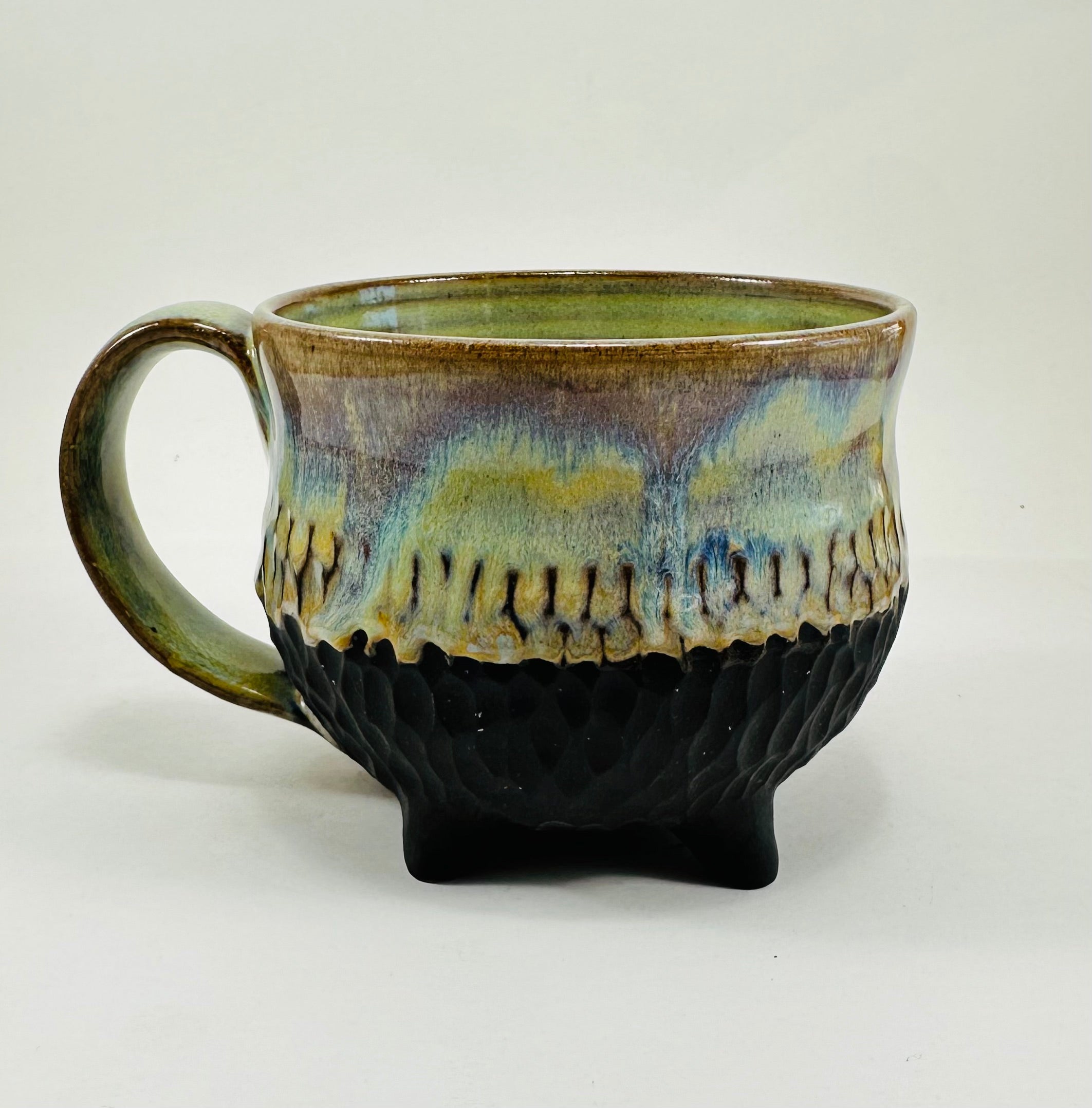 Handmade cauldron mug in a beautiful green, blue and black glaze