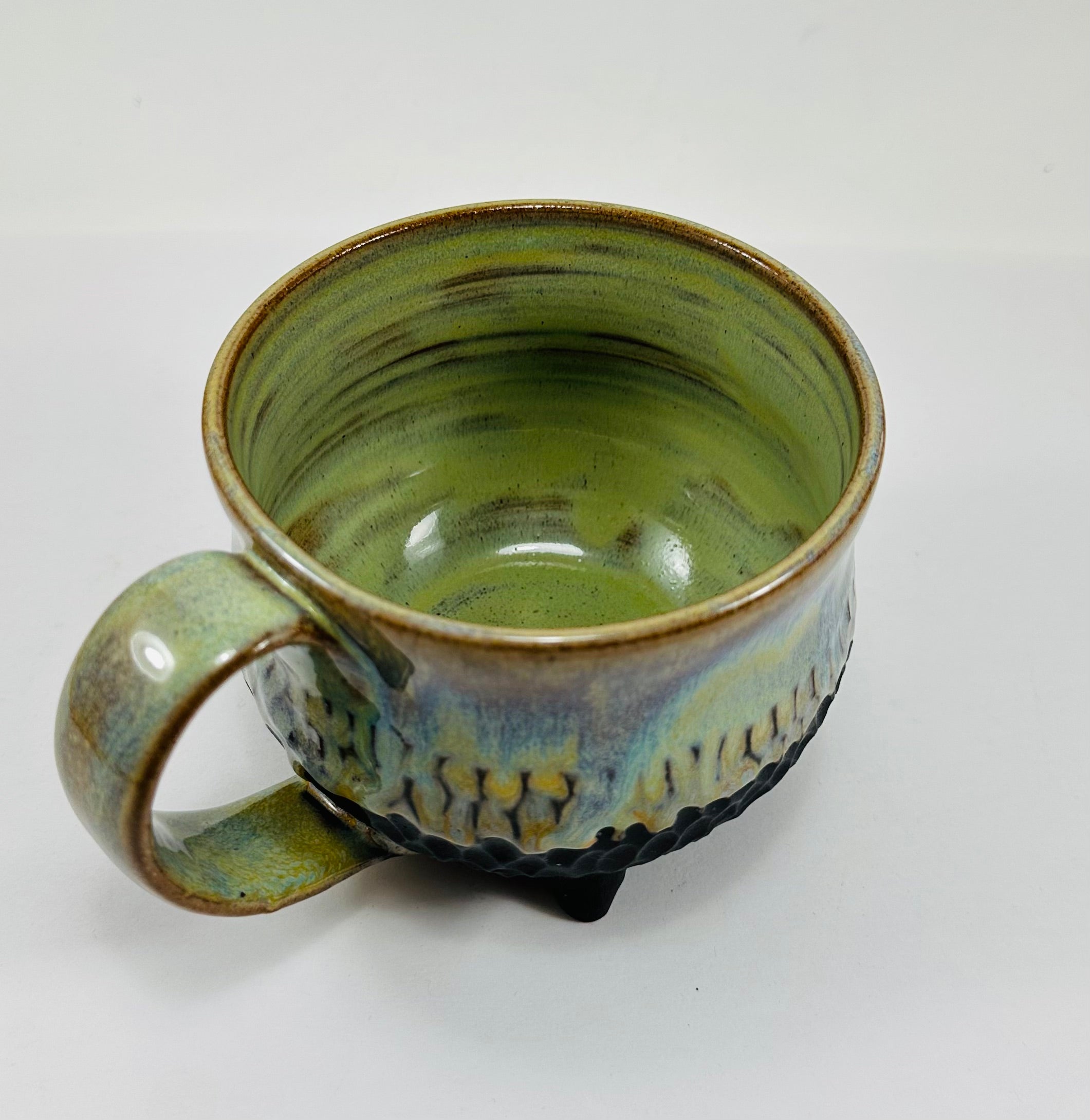 Handmade cauldron mug in a beautiful green, blue and black glaze
