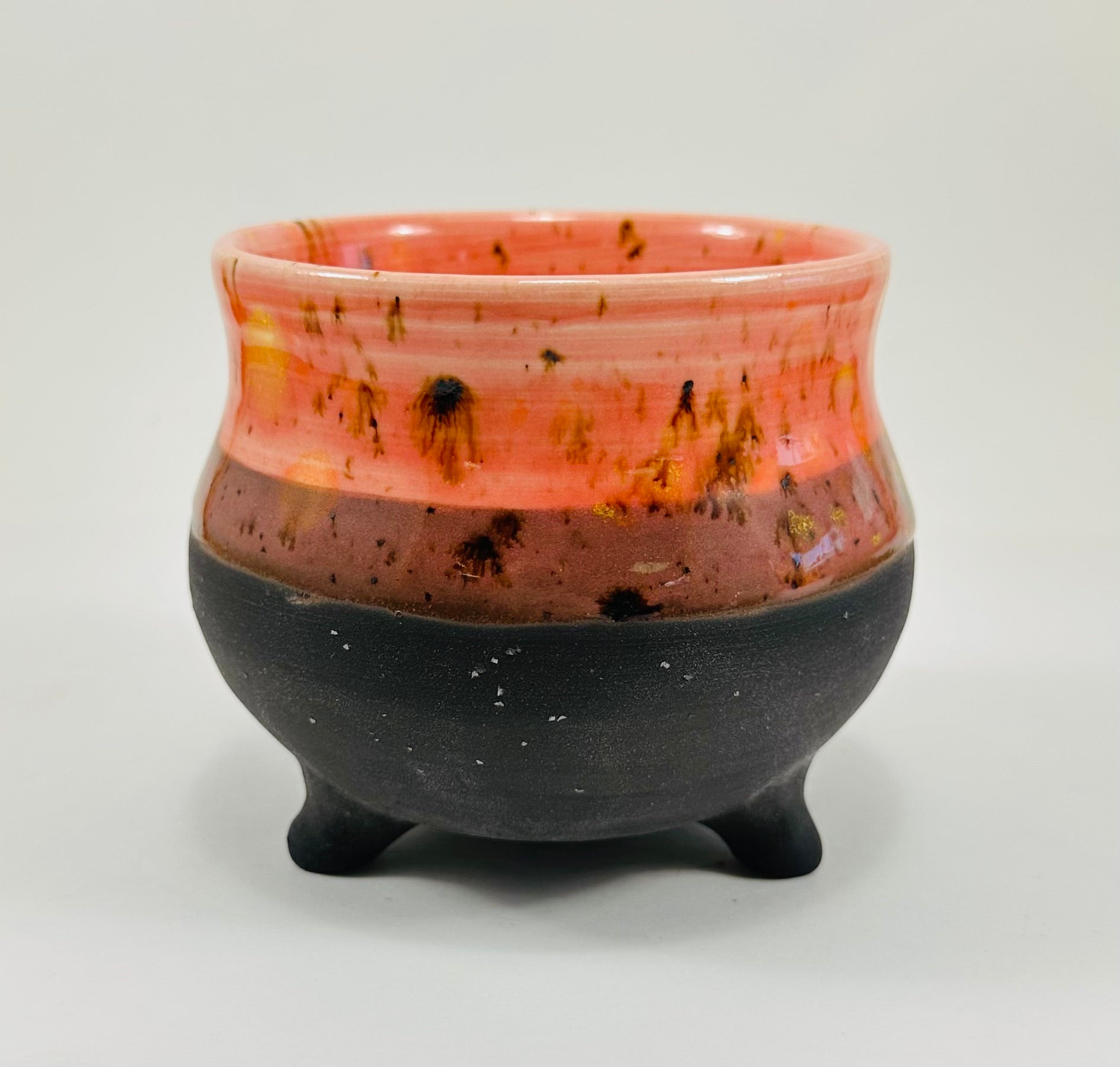 Handmade cauldron in a beautiful orange and black glaze