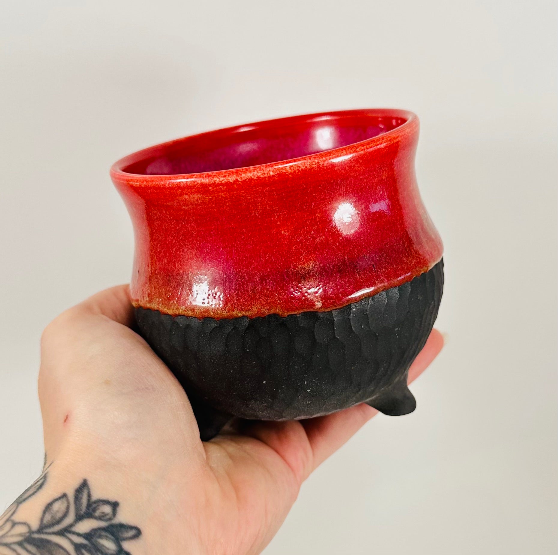 Handmade cauldron in a beautiful red and black glaze