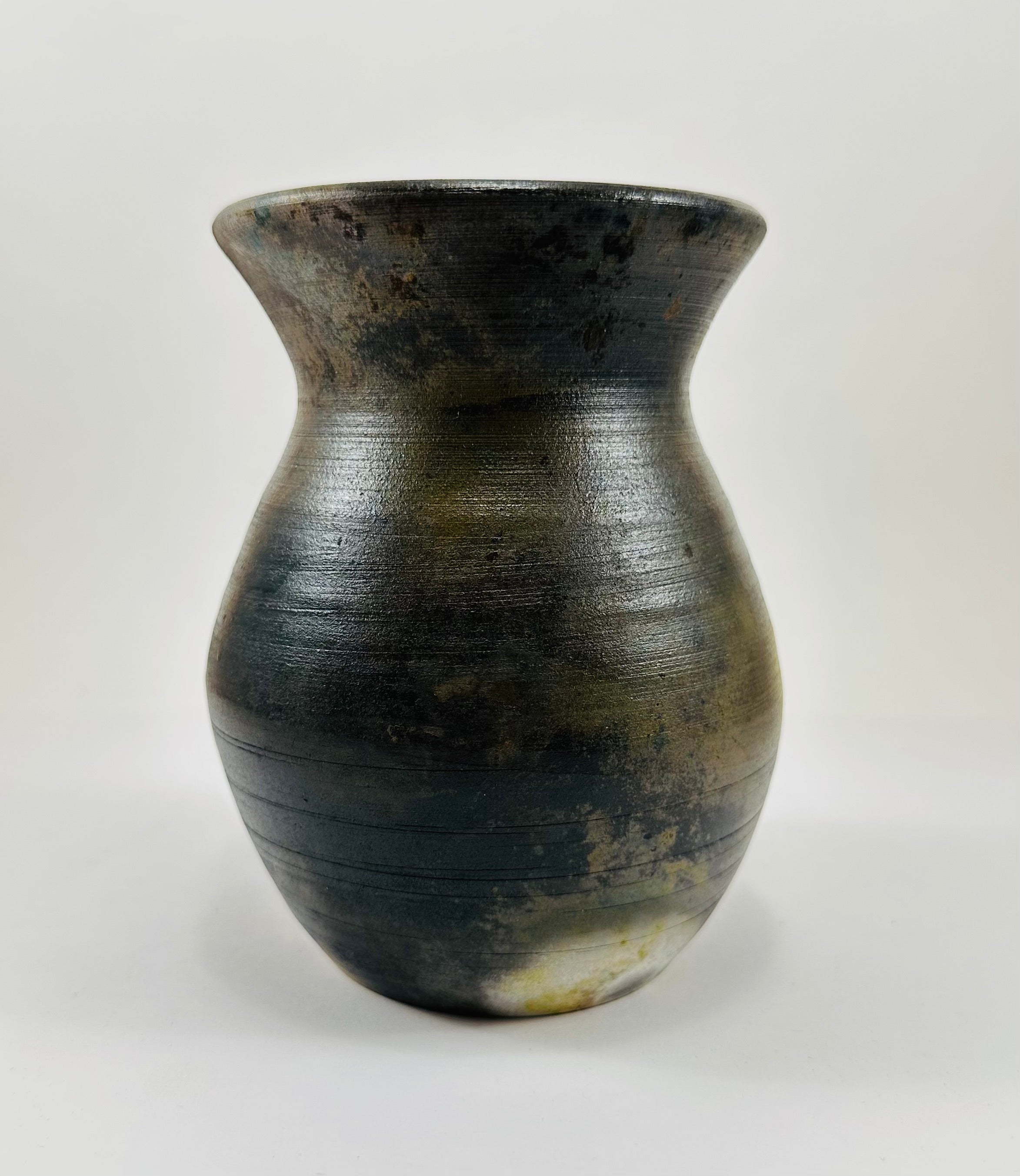 Handmade vase with a brown, white, black and yellow smokey finish.