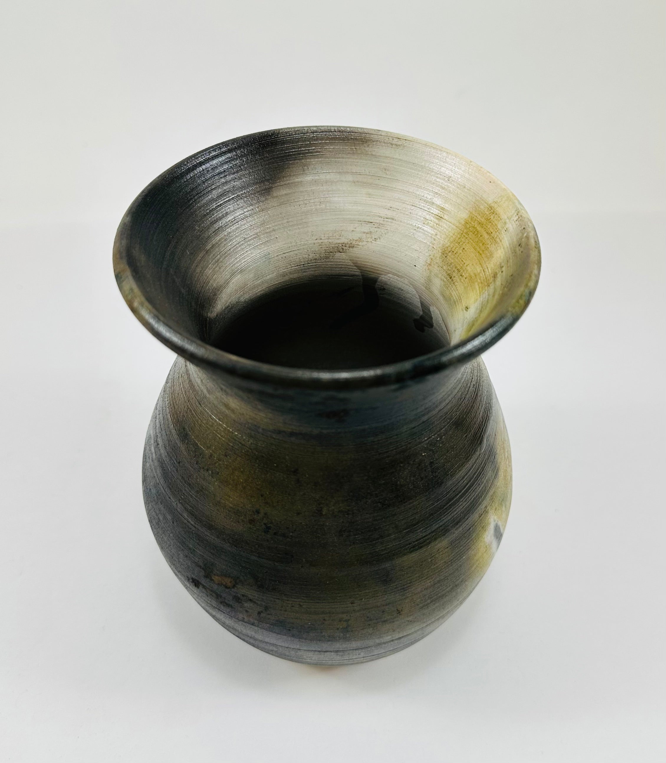 Handmade vase with a brown, white, black and yellow smokey finish.