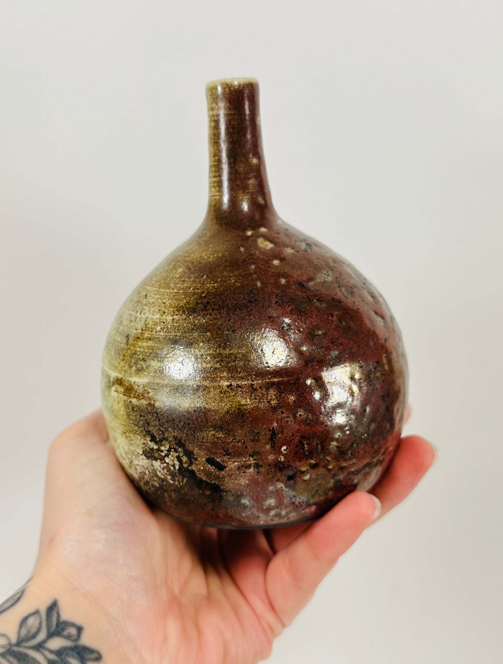 Handmade Raku vase in a beautiful yellow and red glaze.