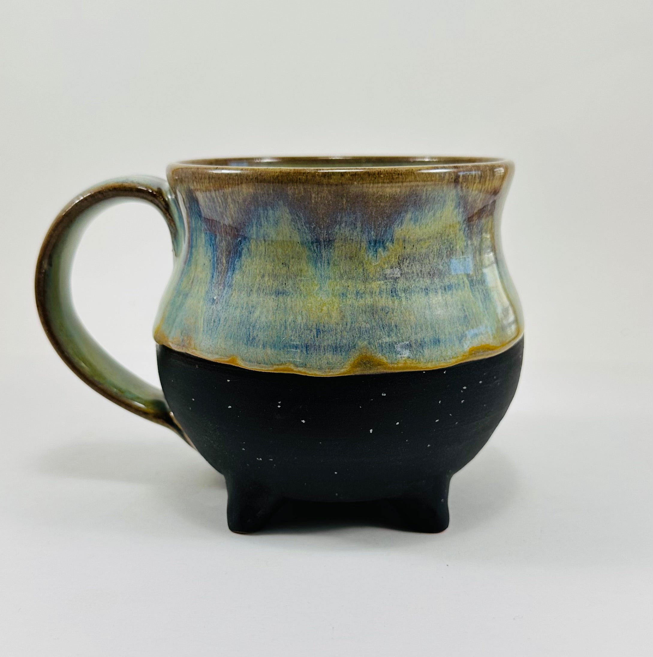 Handmade cauldron mug in a beautiful green, blue and black glaze