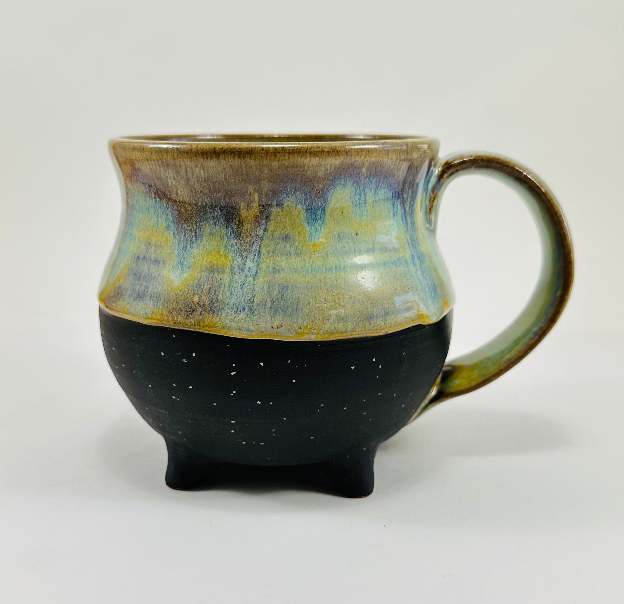 Handmade cauldron mug in a beautiful green, blue and black glaze