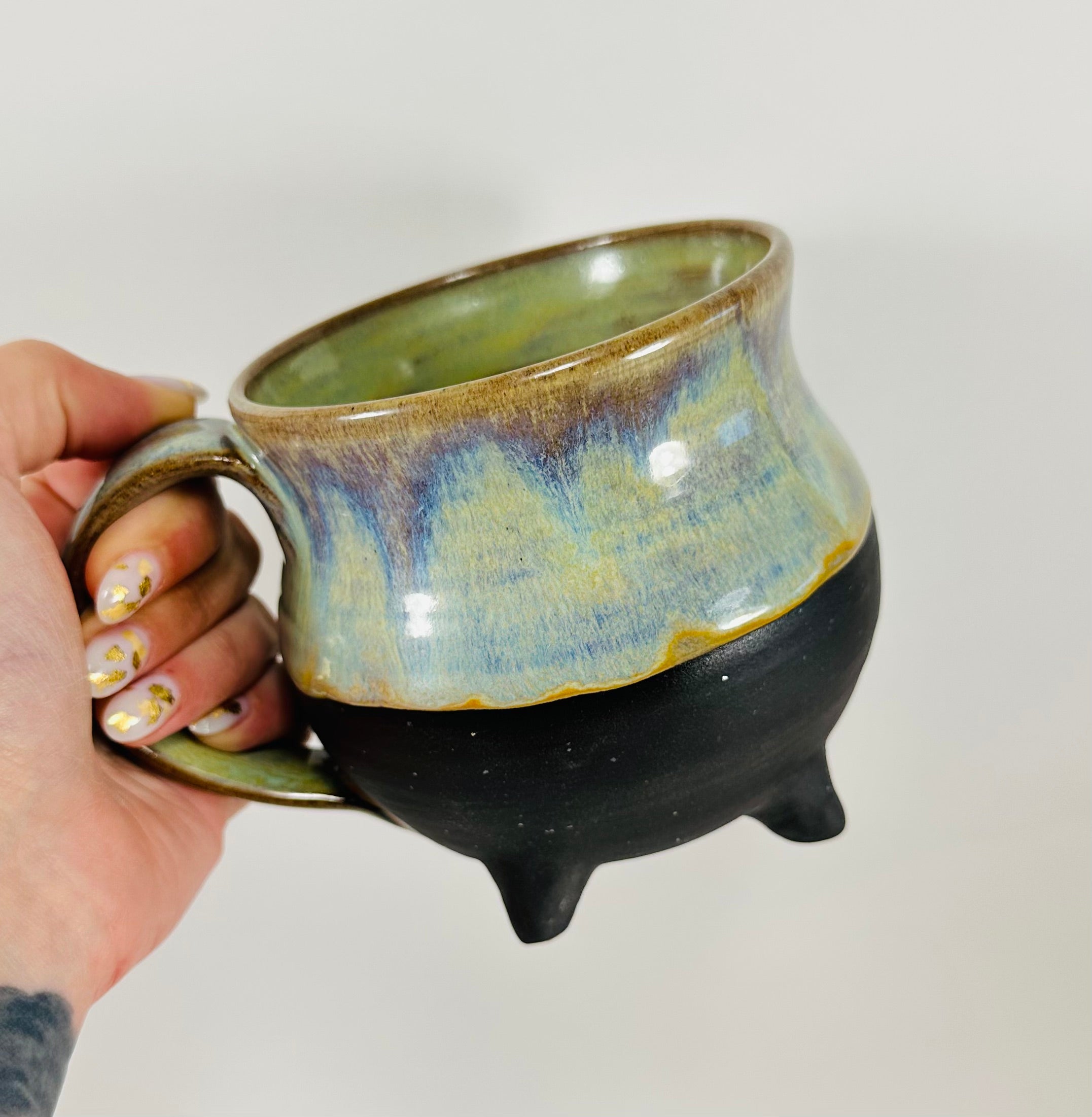 Handmade cauldron mug in a beautiful green, blue and black glaze