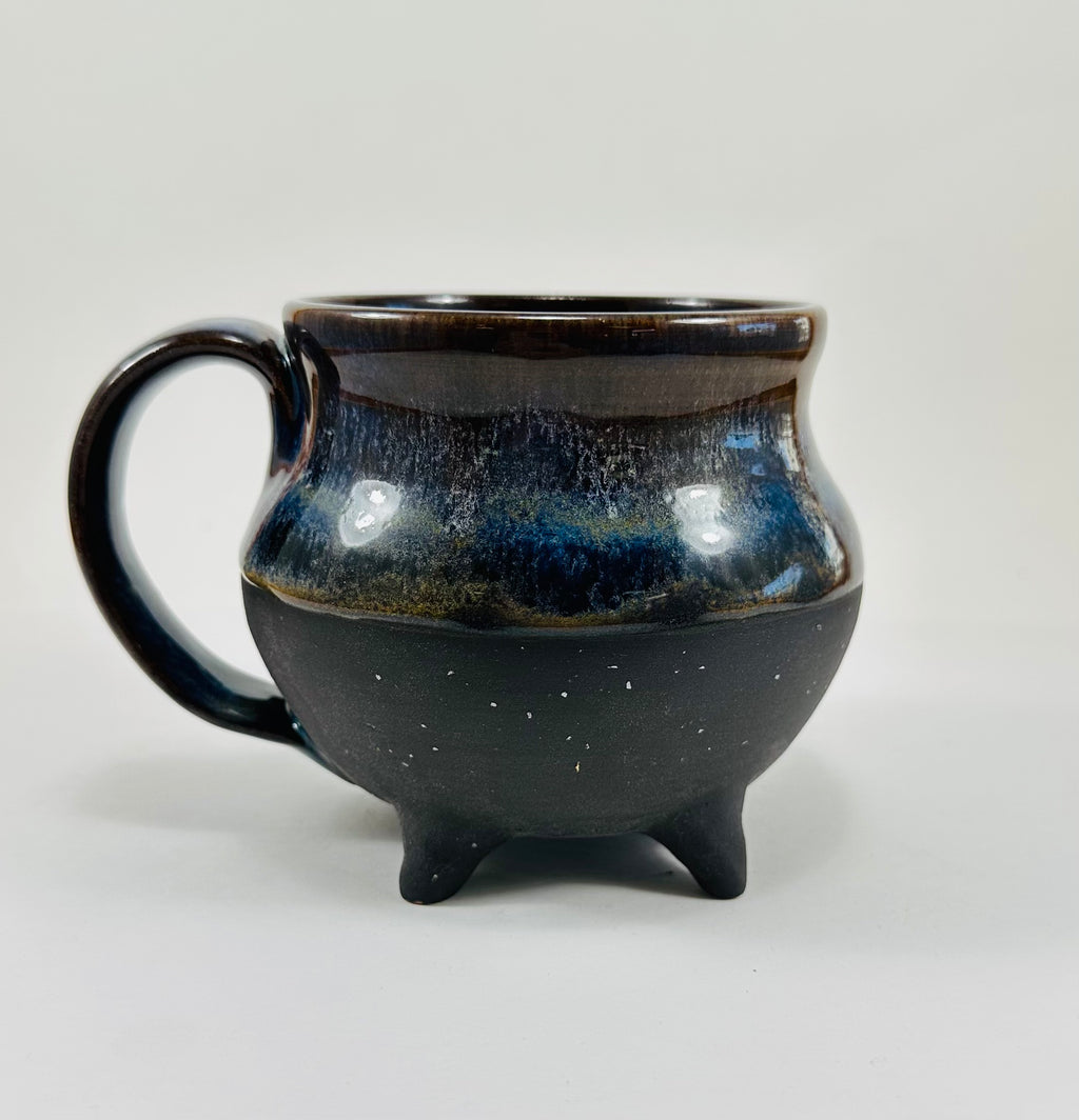 Handmade cauldron mug in a beautiful blue and black glaze