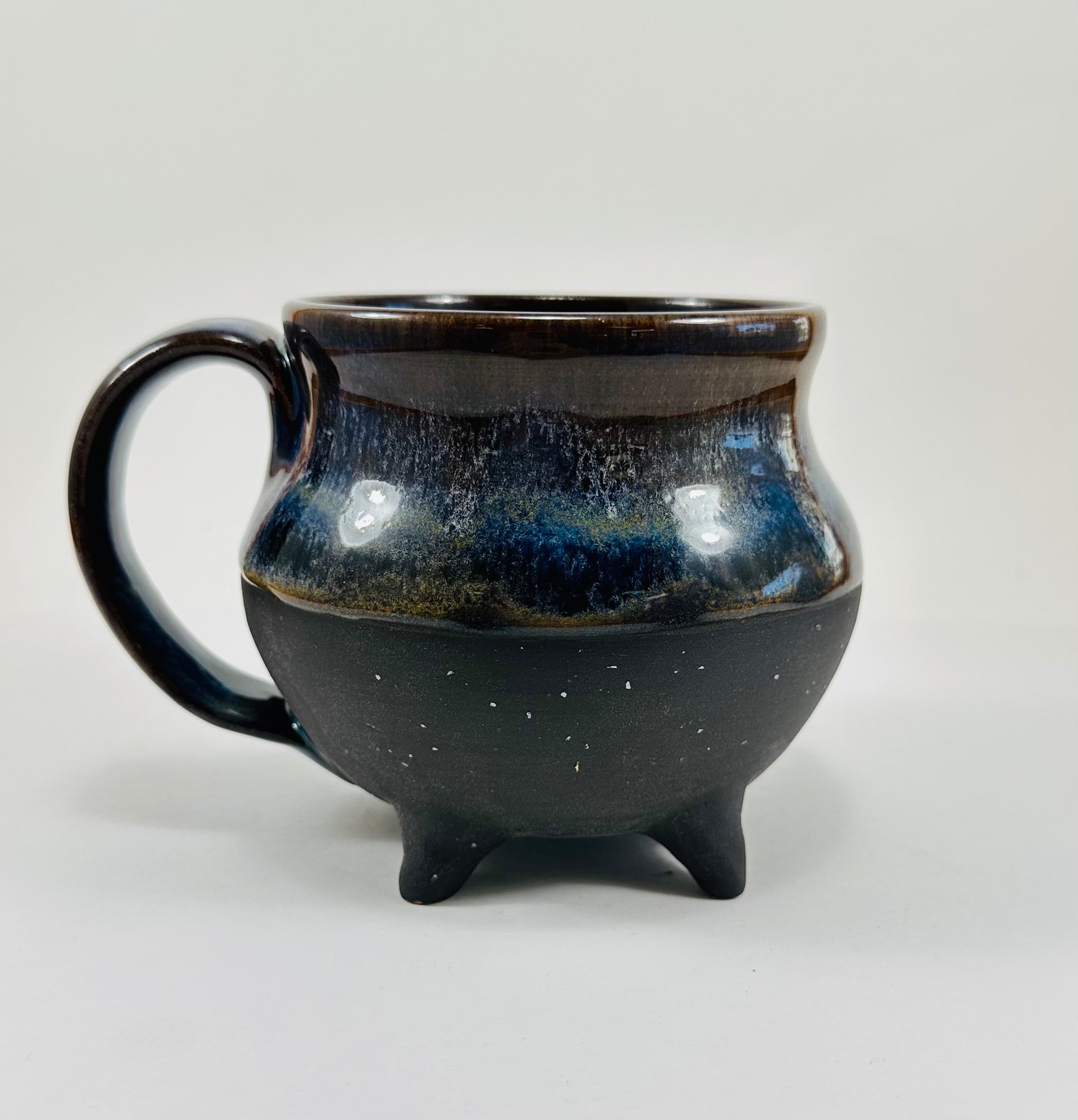Handmade cauldron mug in a beautiful blue and black glaze