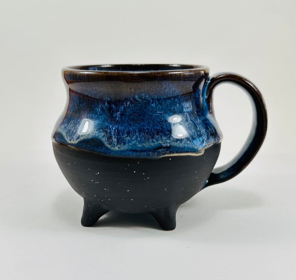 Handmade cauldron mug in a beautiful blue and black glaze