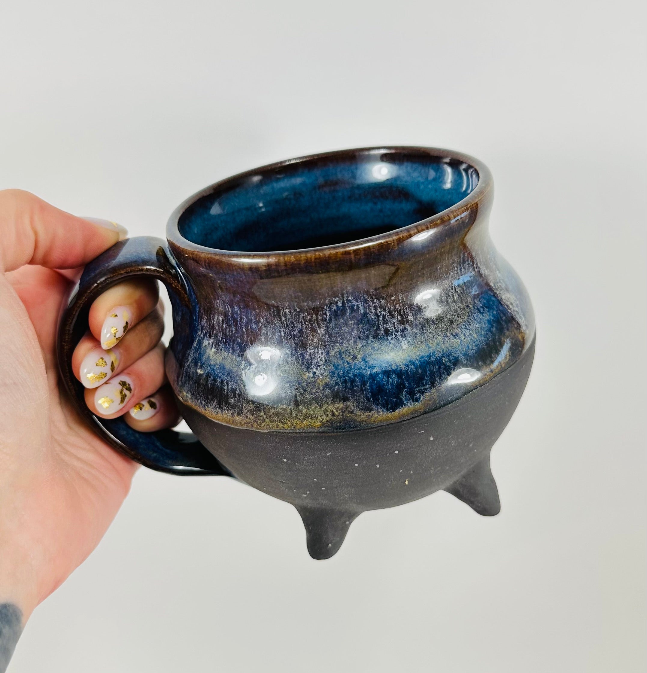 Handmade cauldron mug in a beautiful blue and black glaze