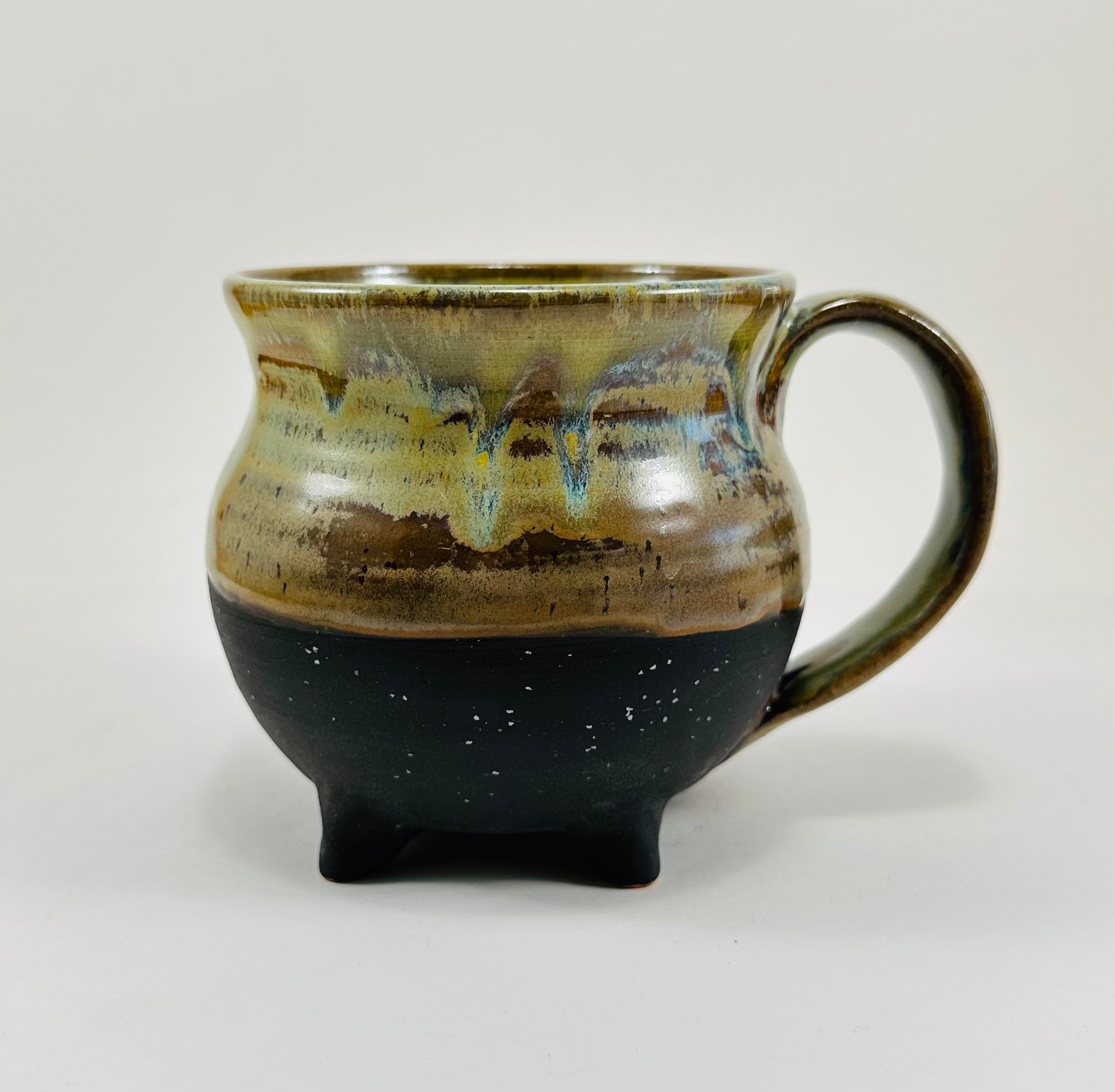 Handmade cauldron mug in a beautiful green and black glaze
