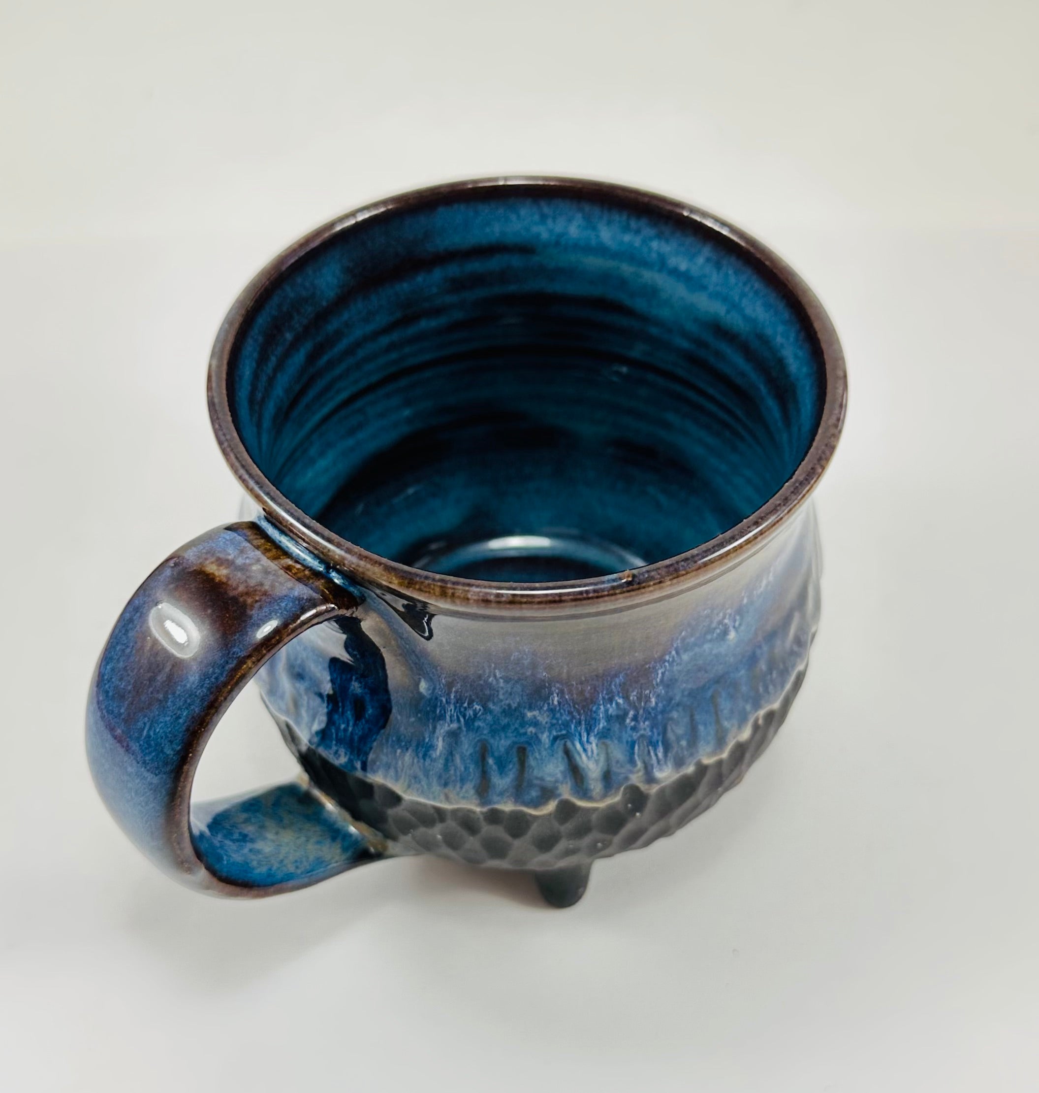 Handmade cauldron mug in a beautiful blue and black glaze