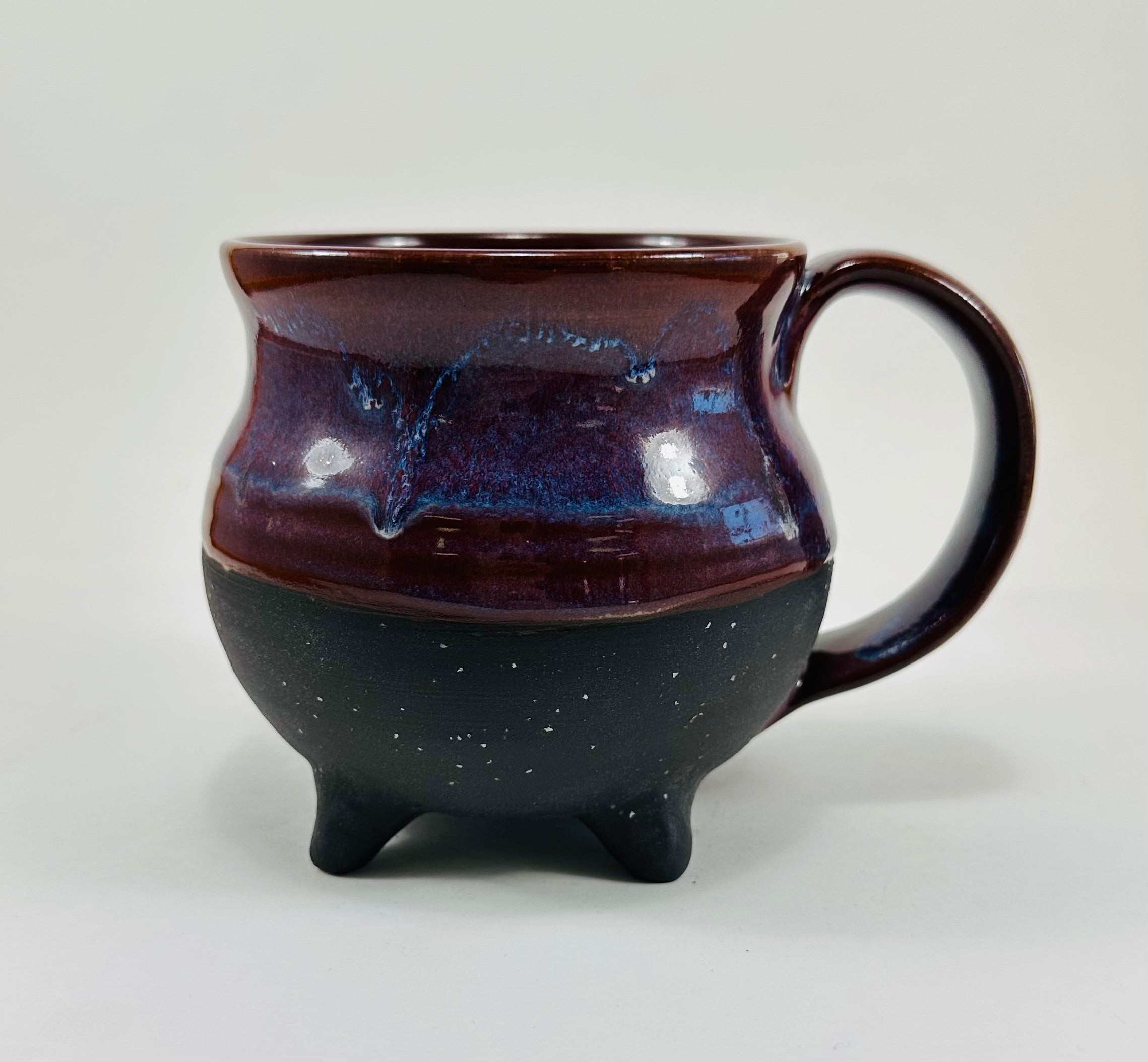 Handmade cauldron mug in a beautiful purple and black glaze