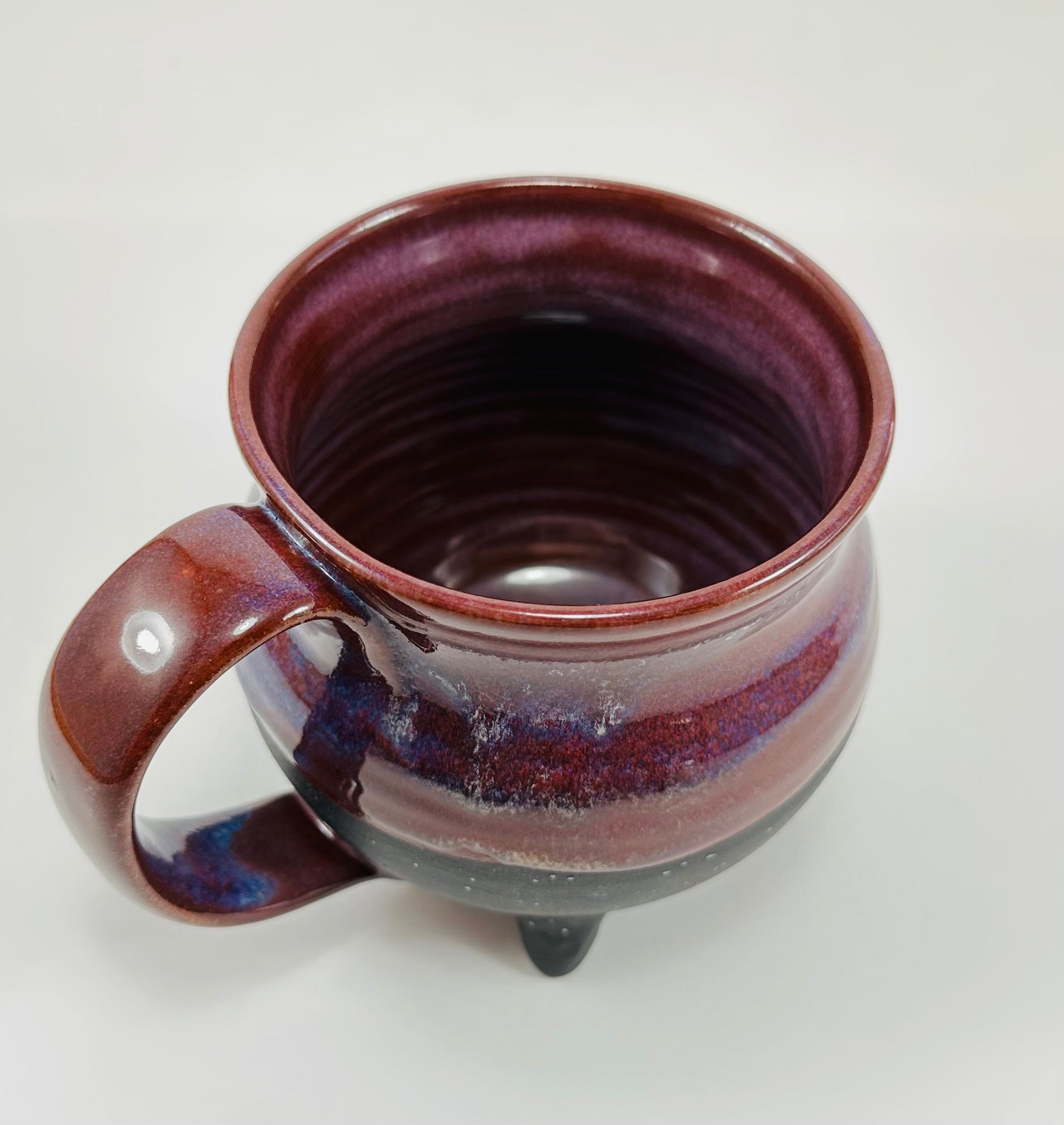 Handmade cauldron mug in a beautiful purple and black glaze