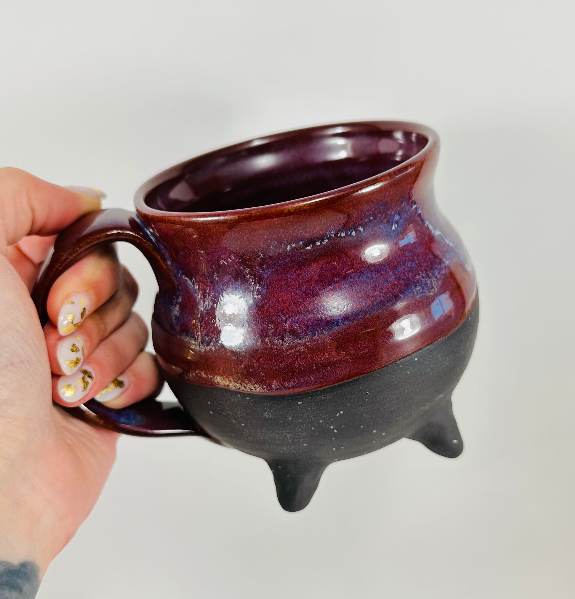 Handmade cauldron mug in a beautiful purple and black glaze