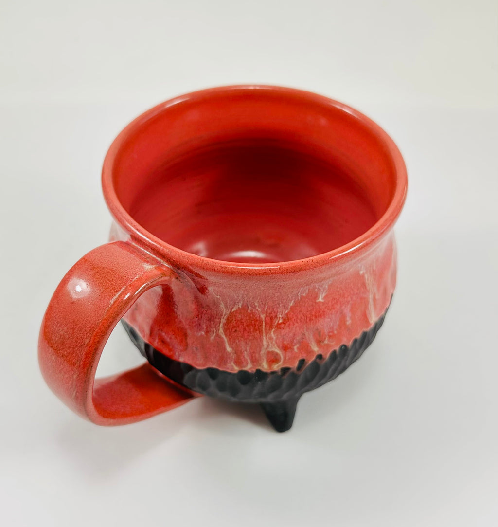Handmade cauldron mug in a beautiful red and black glaze