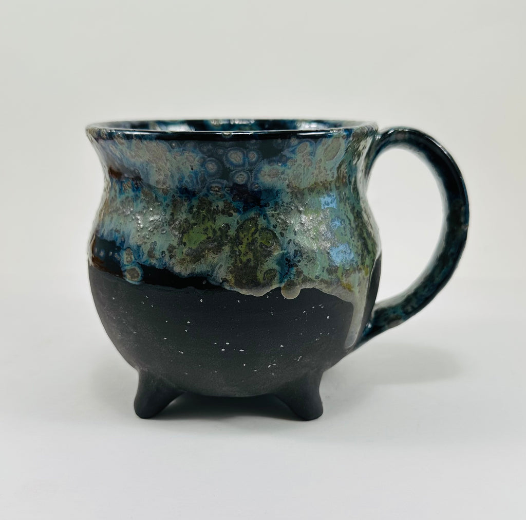 Handmade cauldron mug in a beautiful blue, green and black glaze