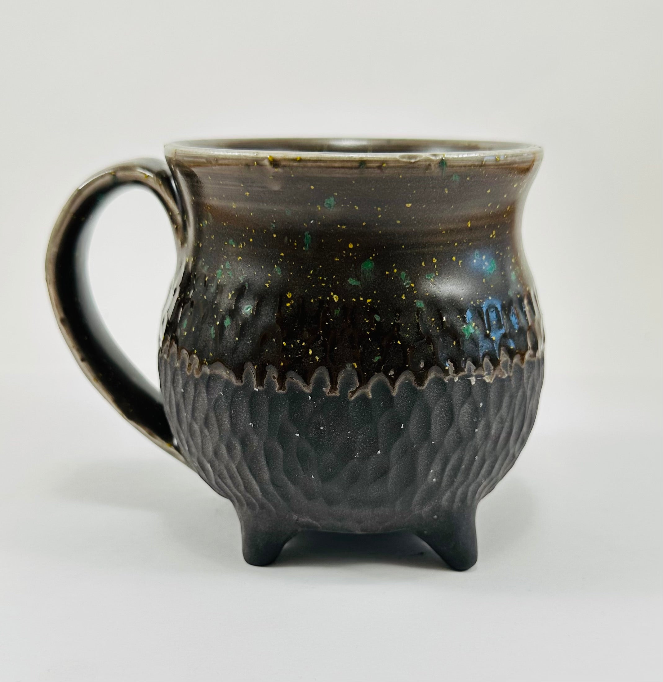 Handmade cauldron mug in a beautiful sprinkle and black glaze