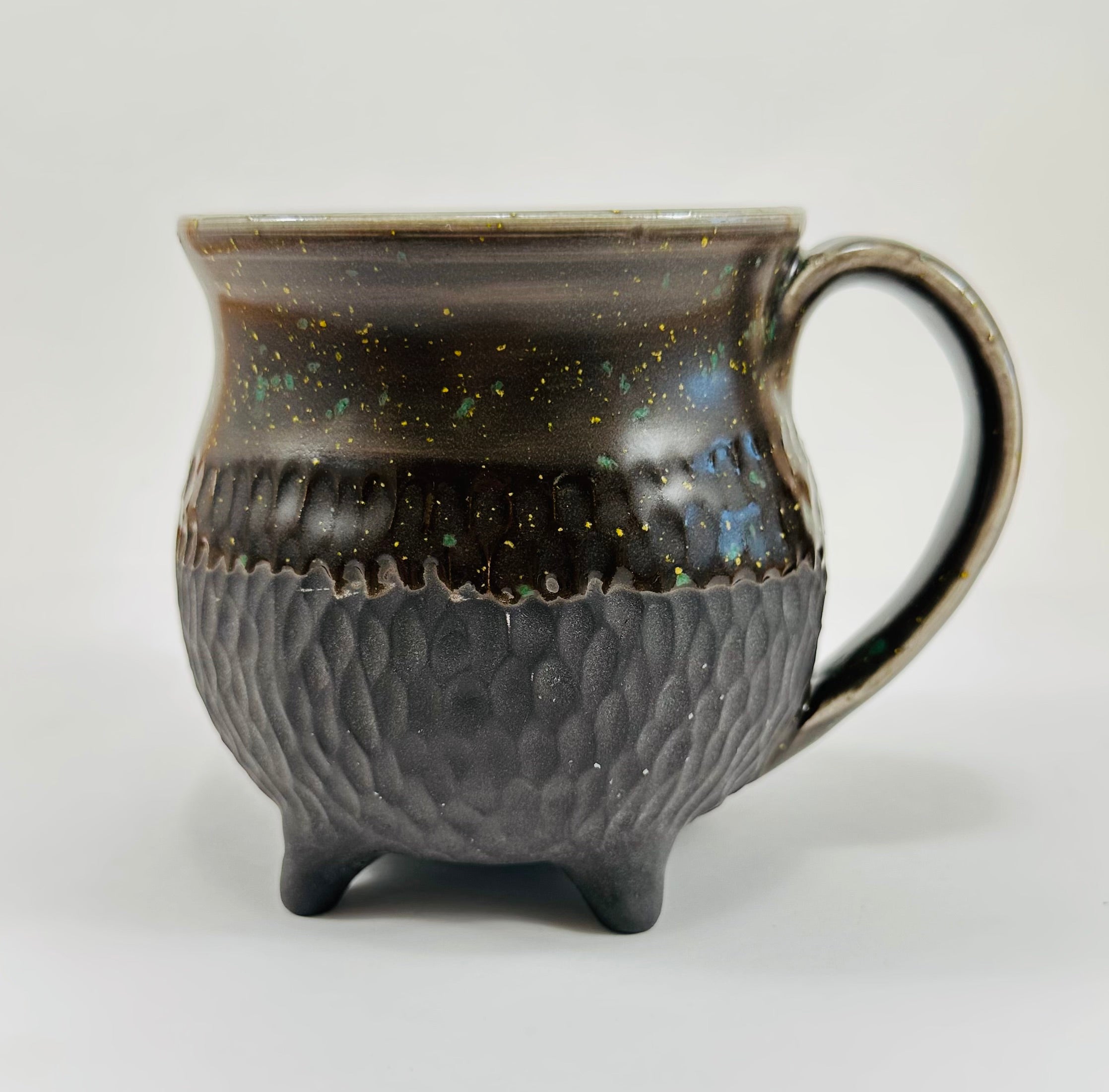 Handmade cauldron mug in a beautiful sprinkle and black glaze