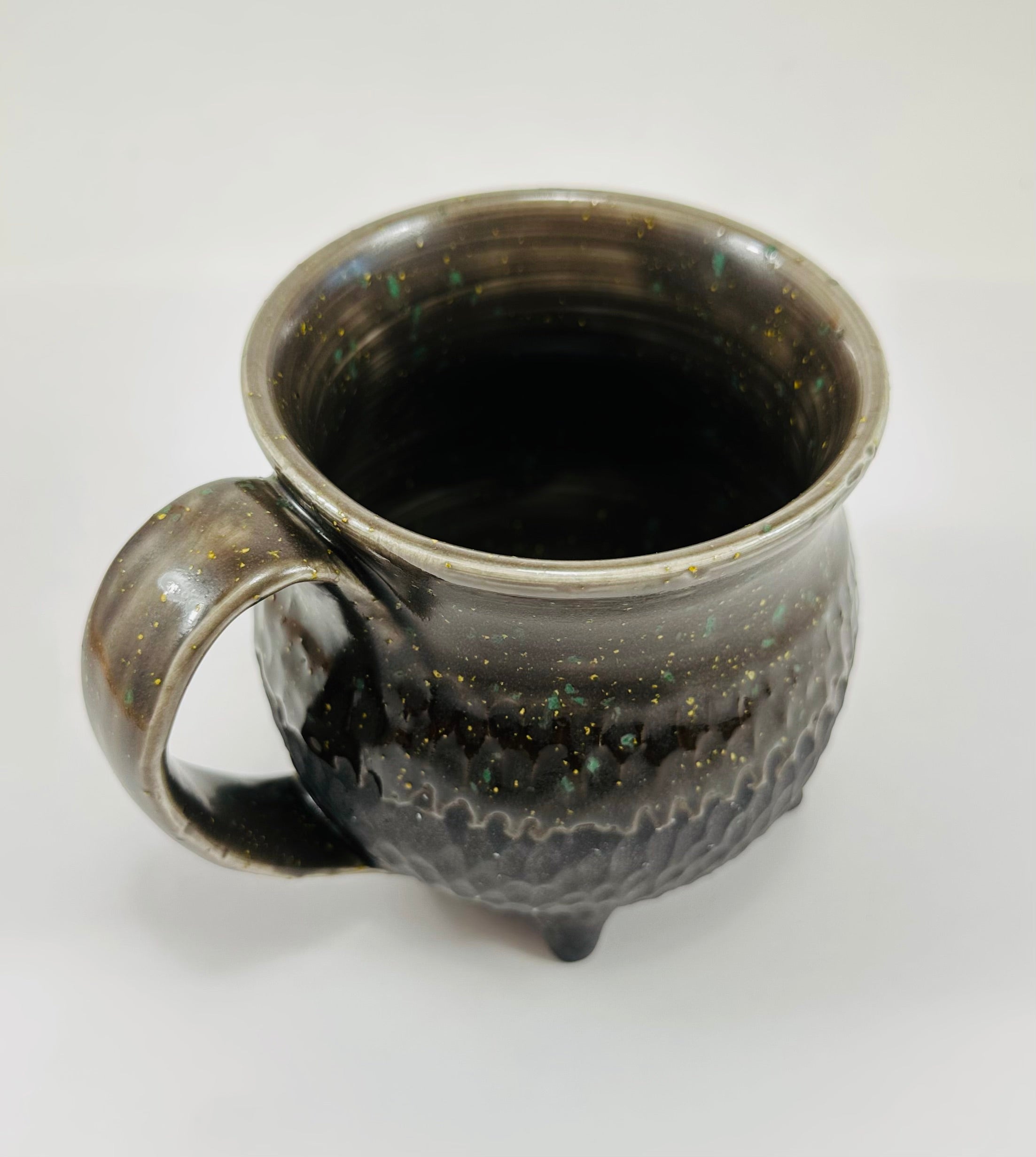 Handmade cauldron mug in a beautiful sprinkle and black glaze