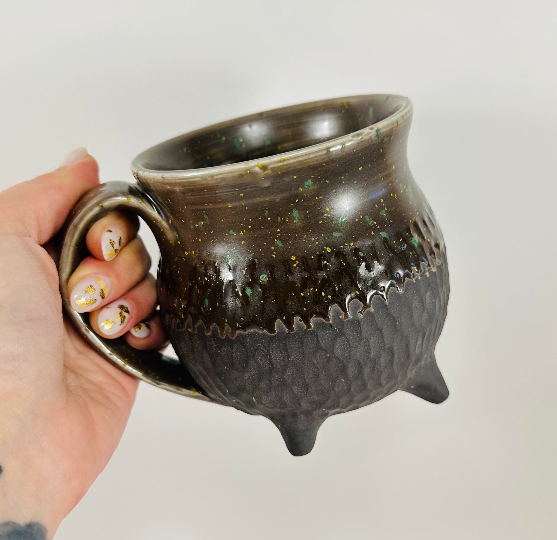 Handmade cauldron mug in a beautiful sprinkle and black glaze