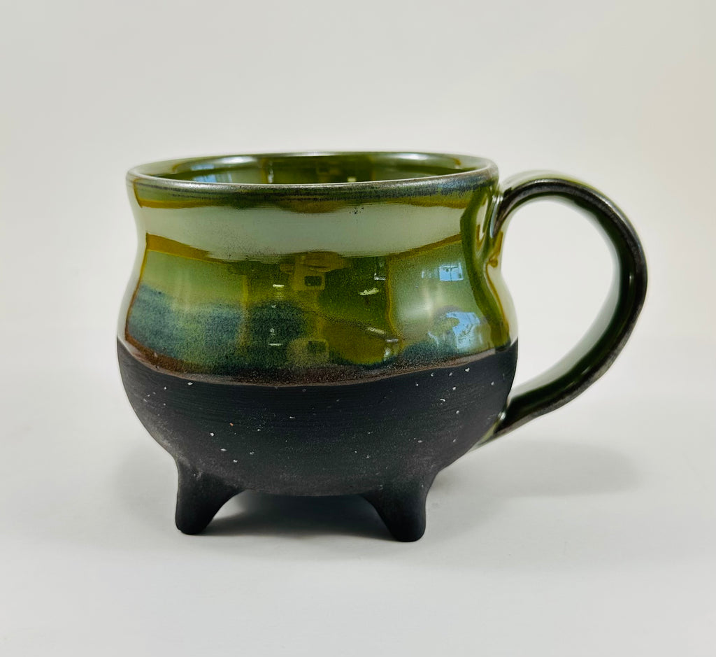Handmade cauldron mug in a beautiful green and black glaze