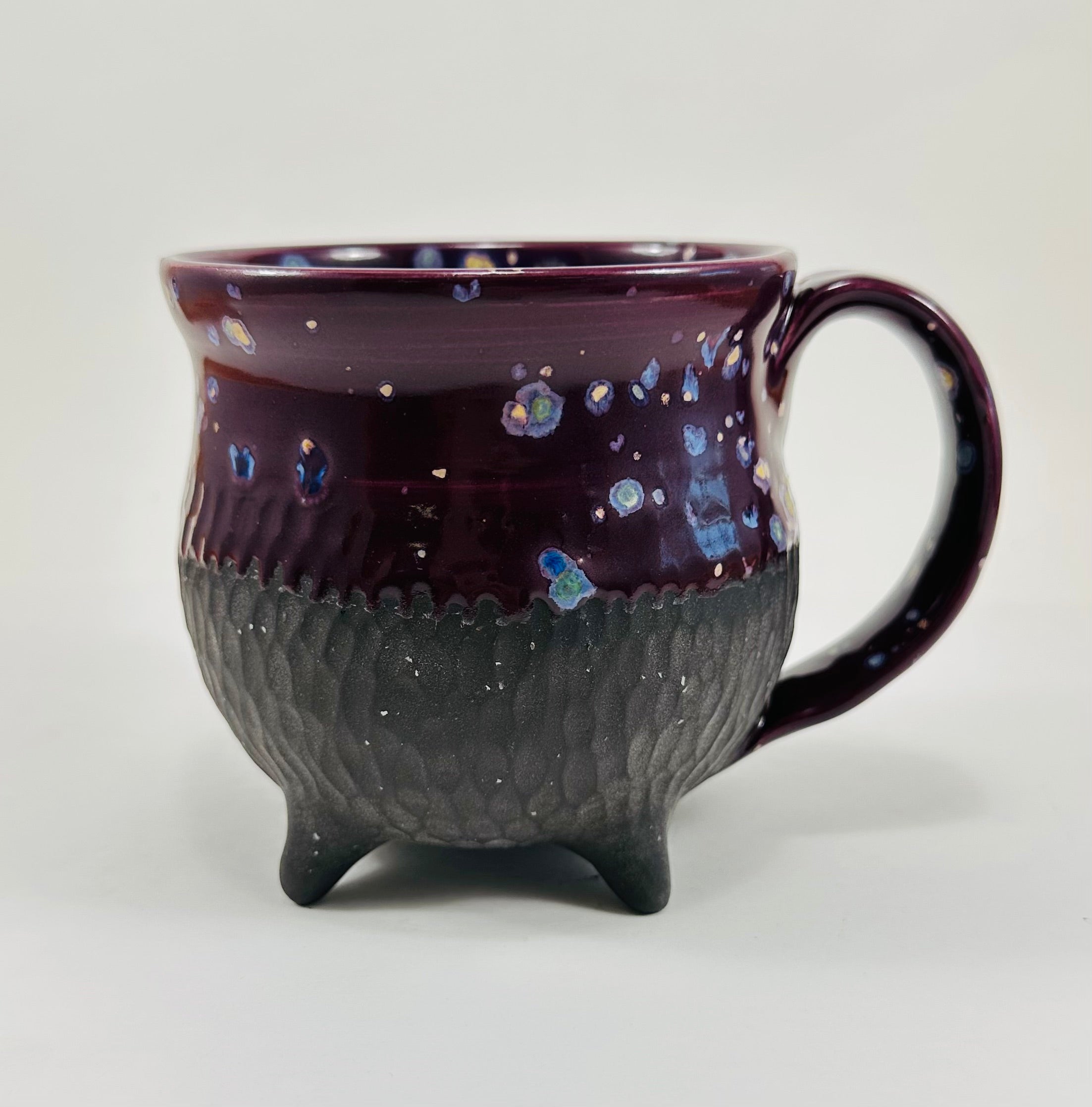 Handmade cauldron mug in a beautiful purple and black glaze