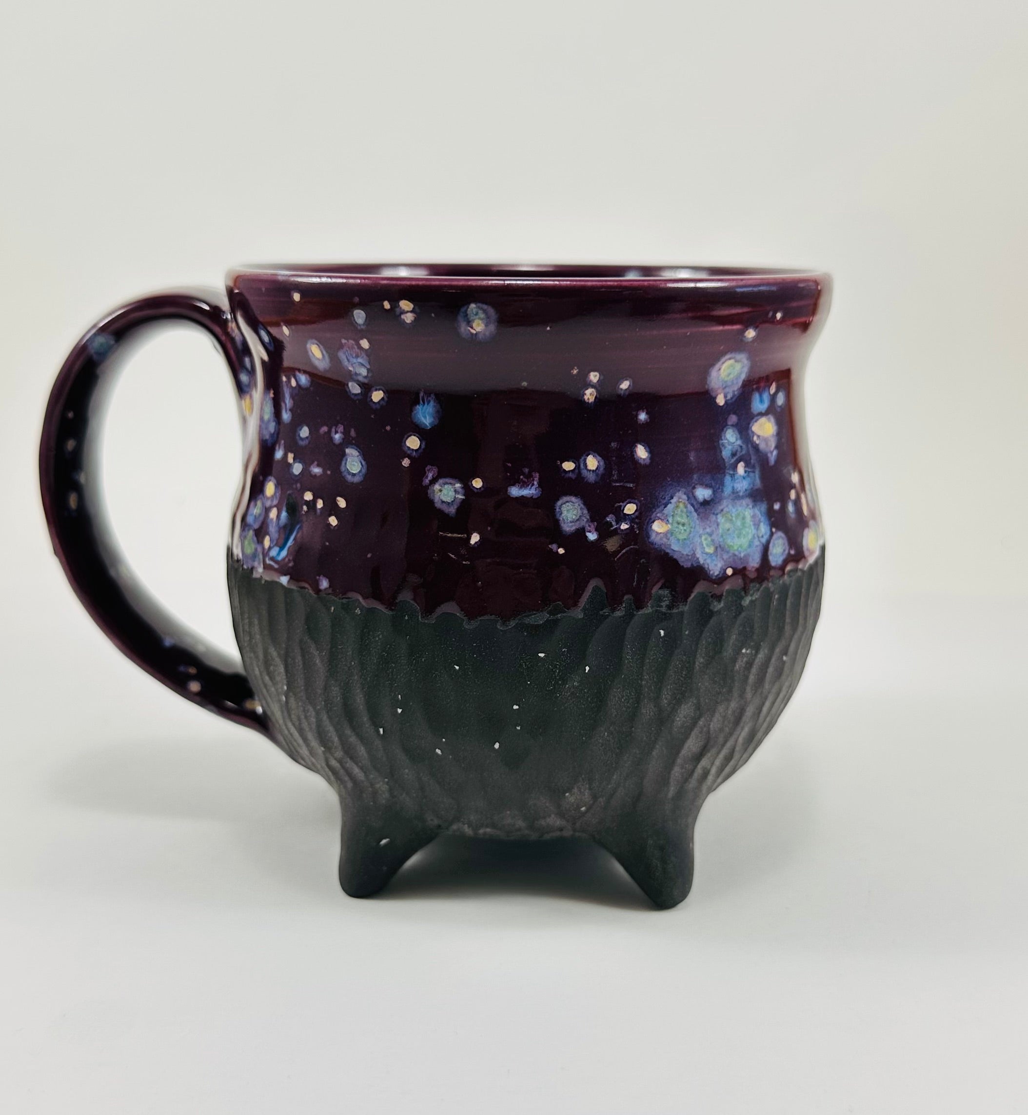 Handmade cauldron mug in a beautiful purple and black glaze