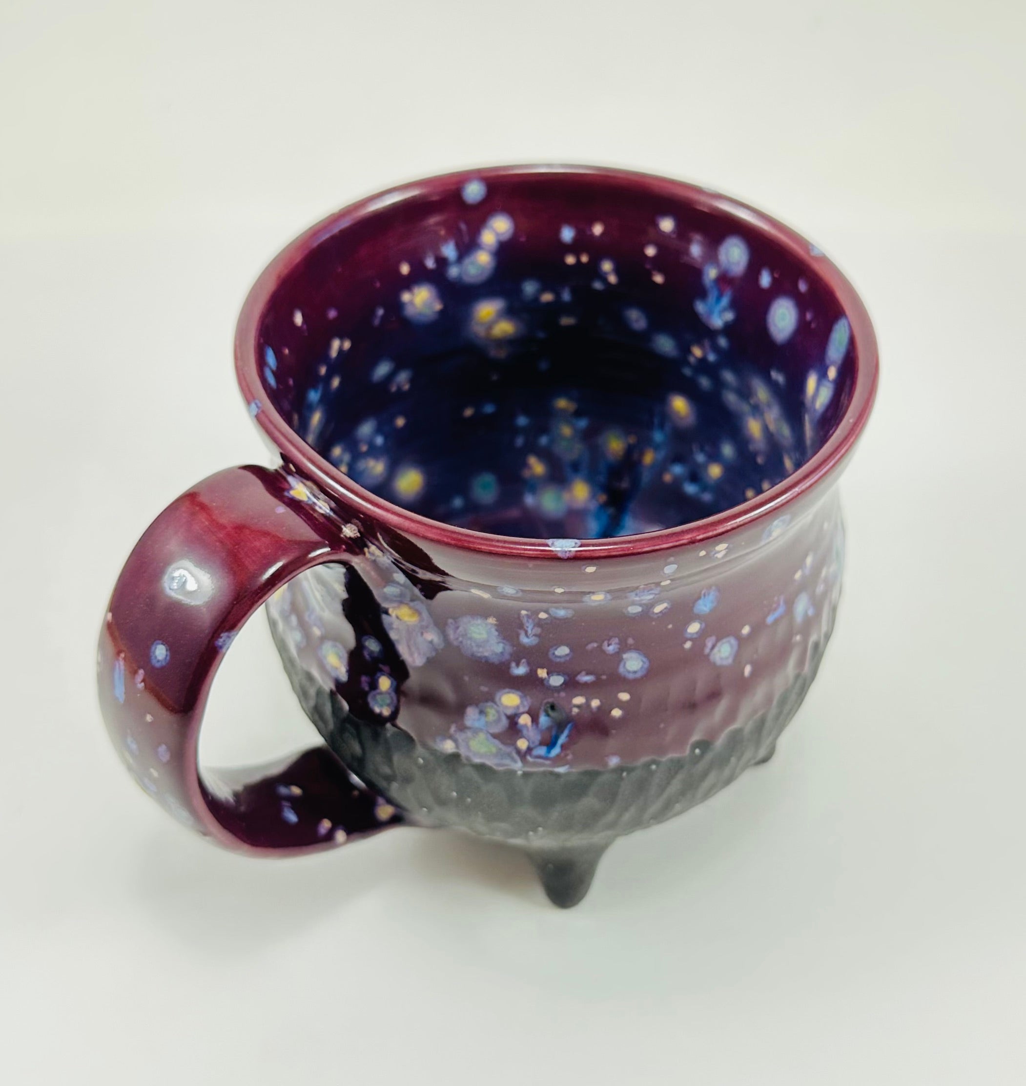 Handmade cauldron mug in a beautiful purple and black glaze