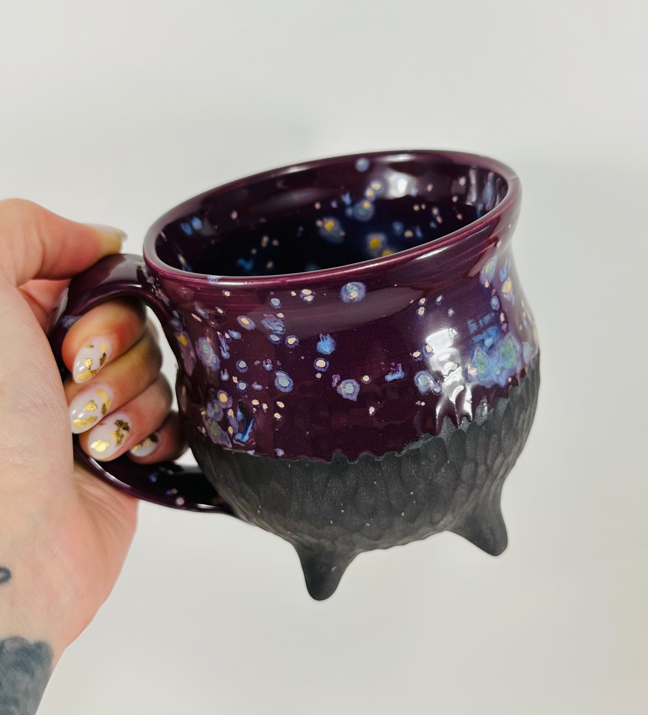Handmade cauldron mug in a beautiful purple and black glaze