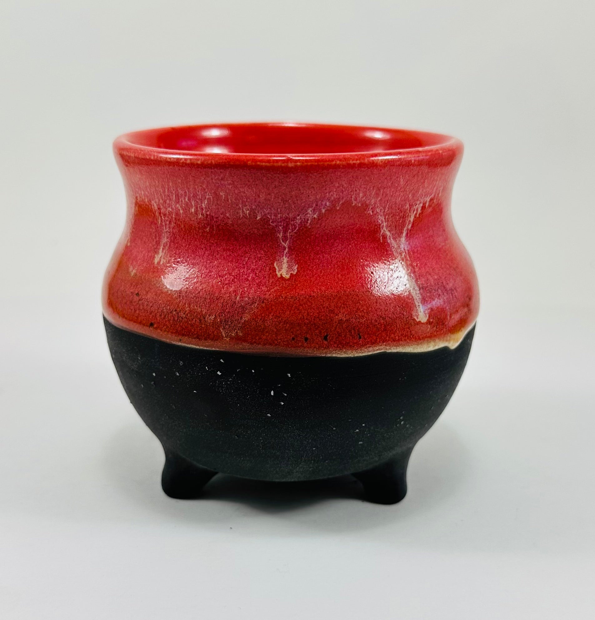 Handmade cauldron in a beautiful red and black glaze