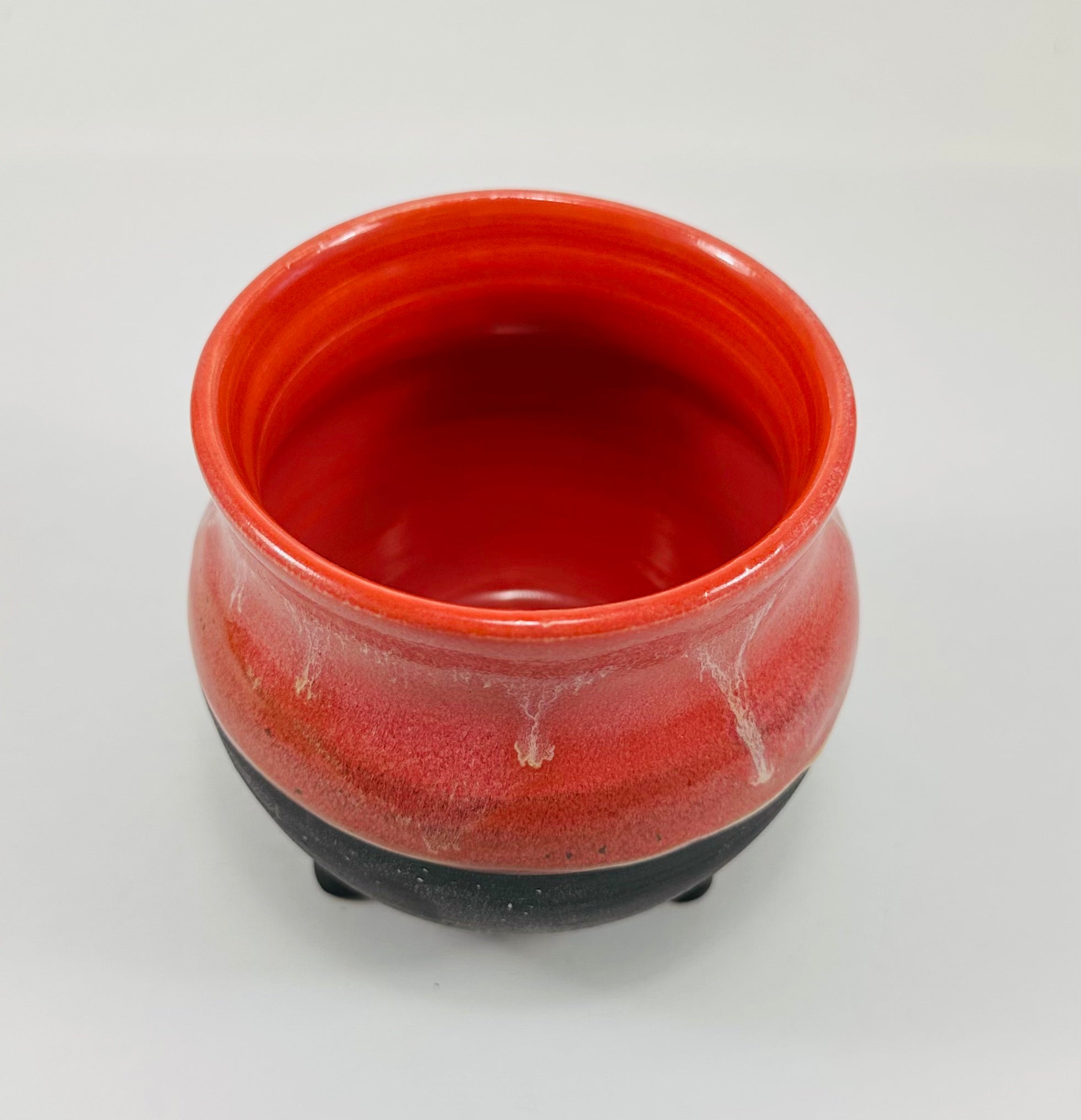 Handmade cauldron in a beautiful red and black glaze