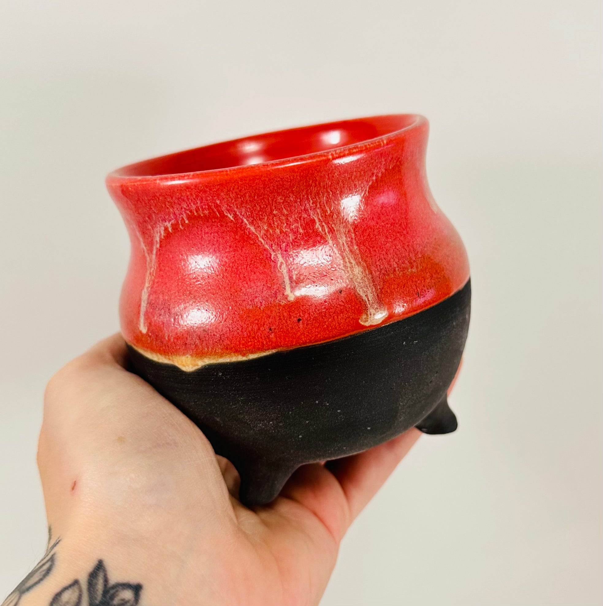 Handmade cauldron in a beautiful red and black glaze