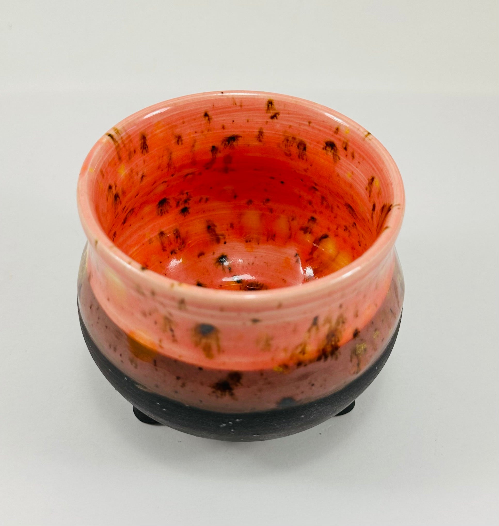 Handmade cauldron in a beautiful orange and black glaze