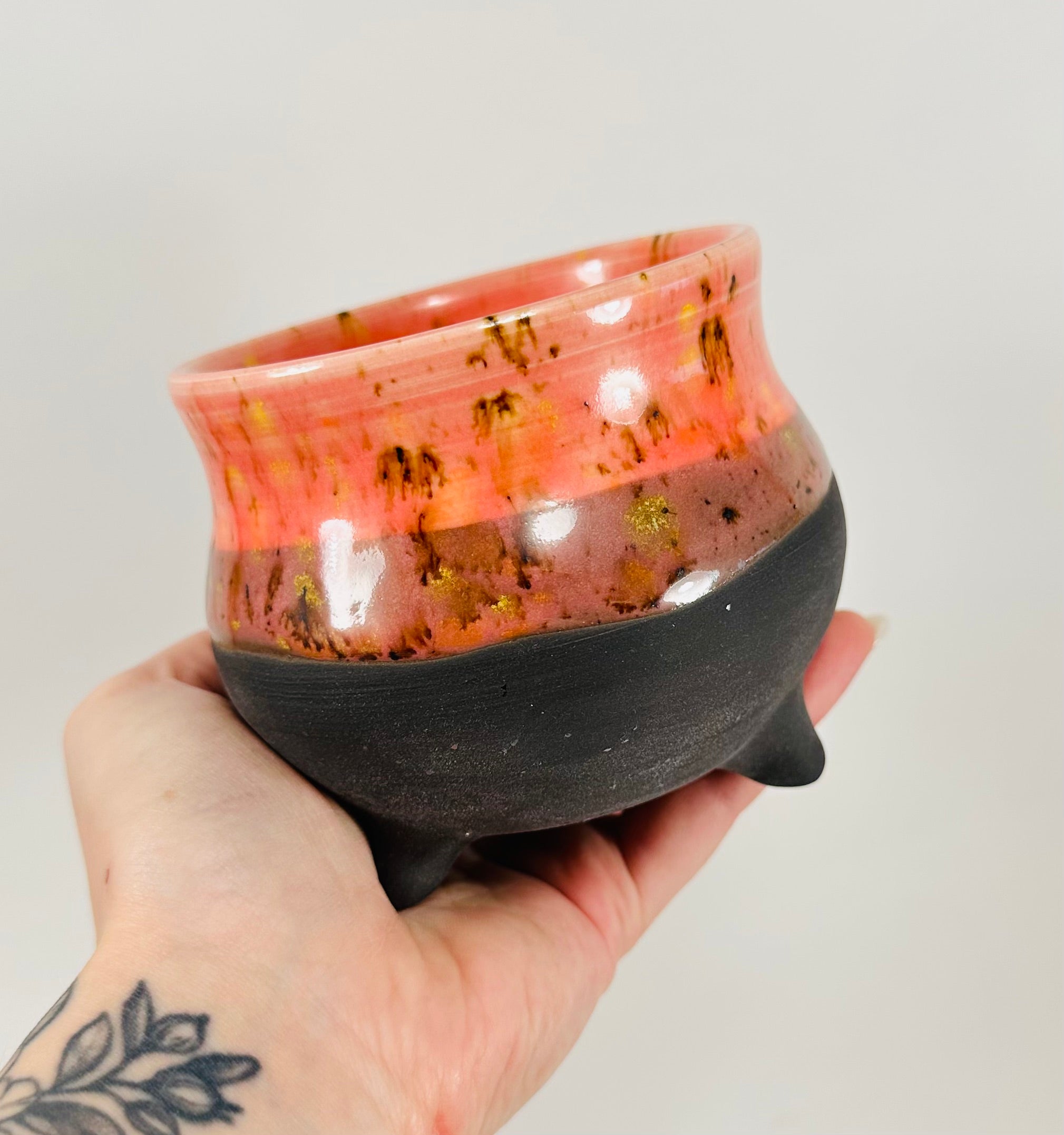 Handmade cauldron in a beautiful orange and black glaze