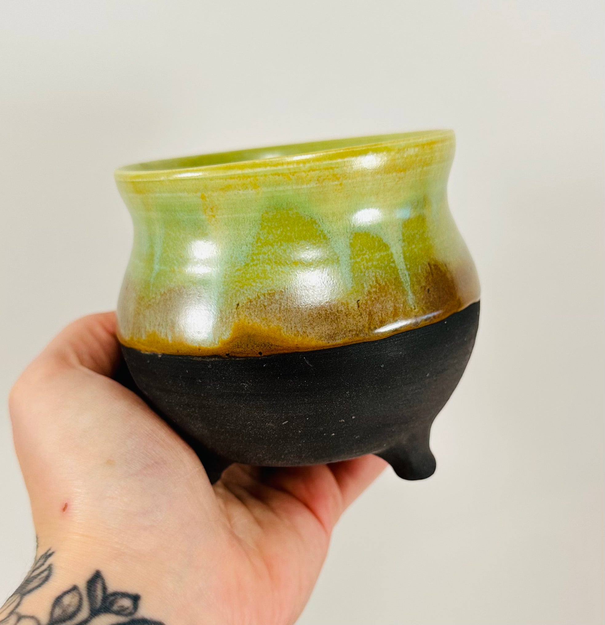 Handmade cauldron in a beautiful green and black glaze