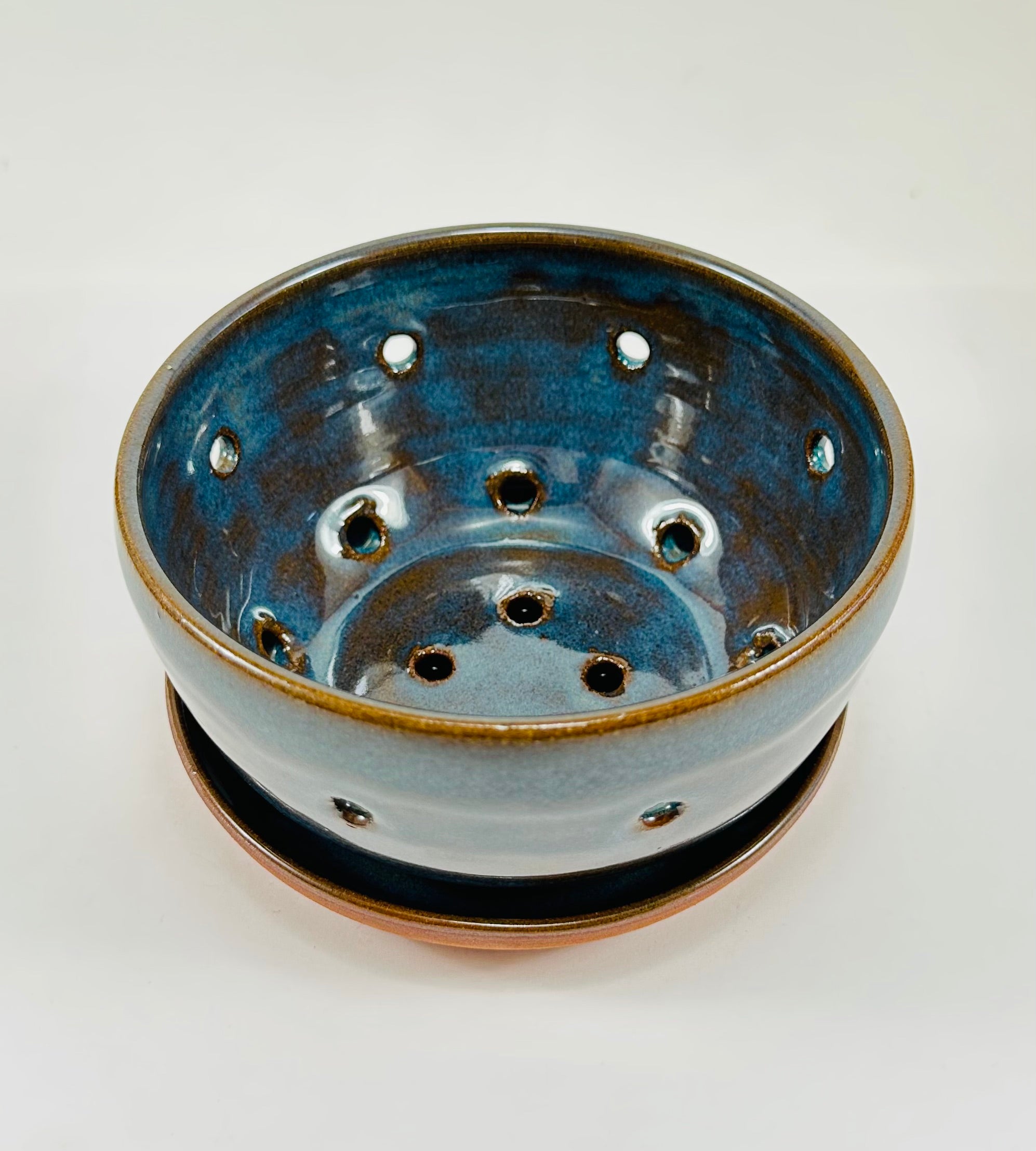 Handmade berry bowl in a beautiful blue and brown glaze.
