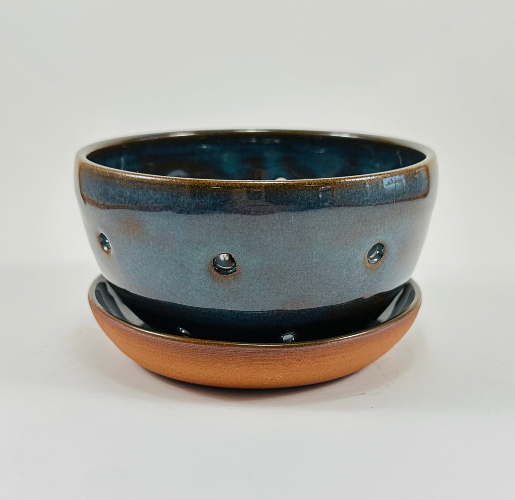 Handmade berry bowl in a beautiful blue and brown glaze.