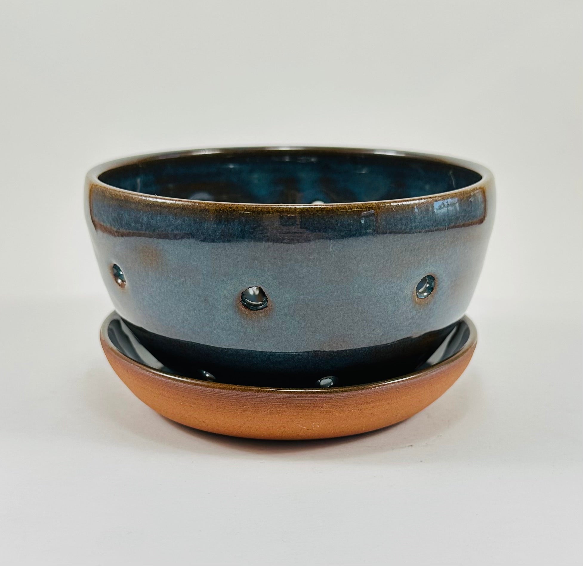 Handmade berry bowl in a beautiful blue and brown glaze.