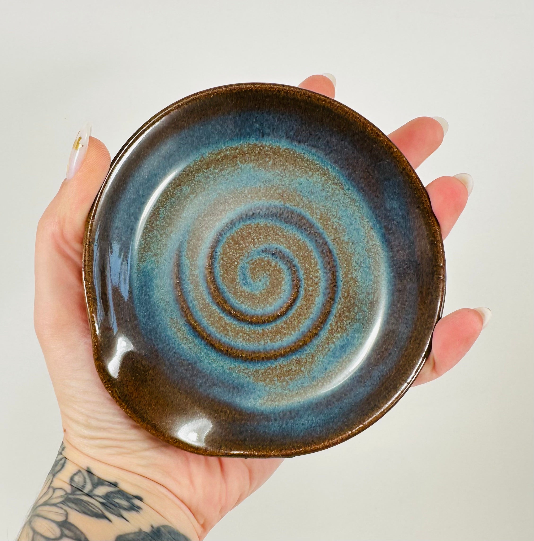 Handmade spoon rest in a beautiful blue and brown glaze.