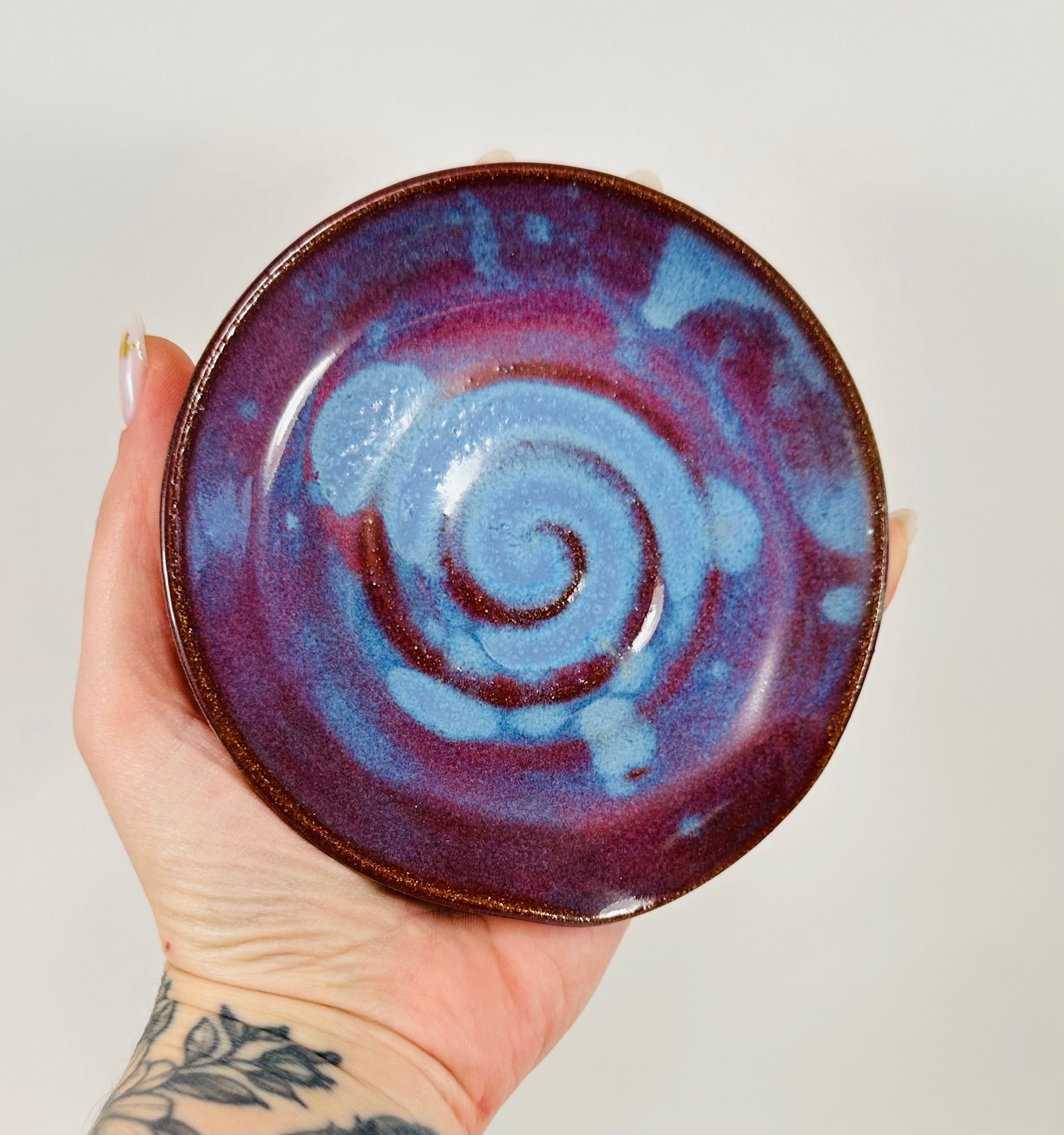 Handmade spoon rest in a beautiful purple and blue glaze.