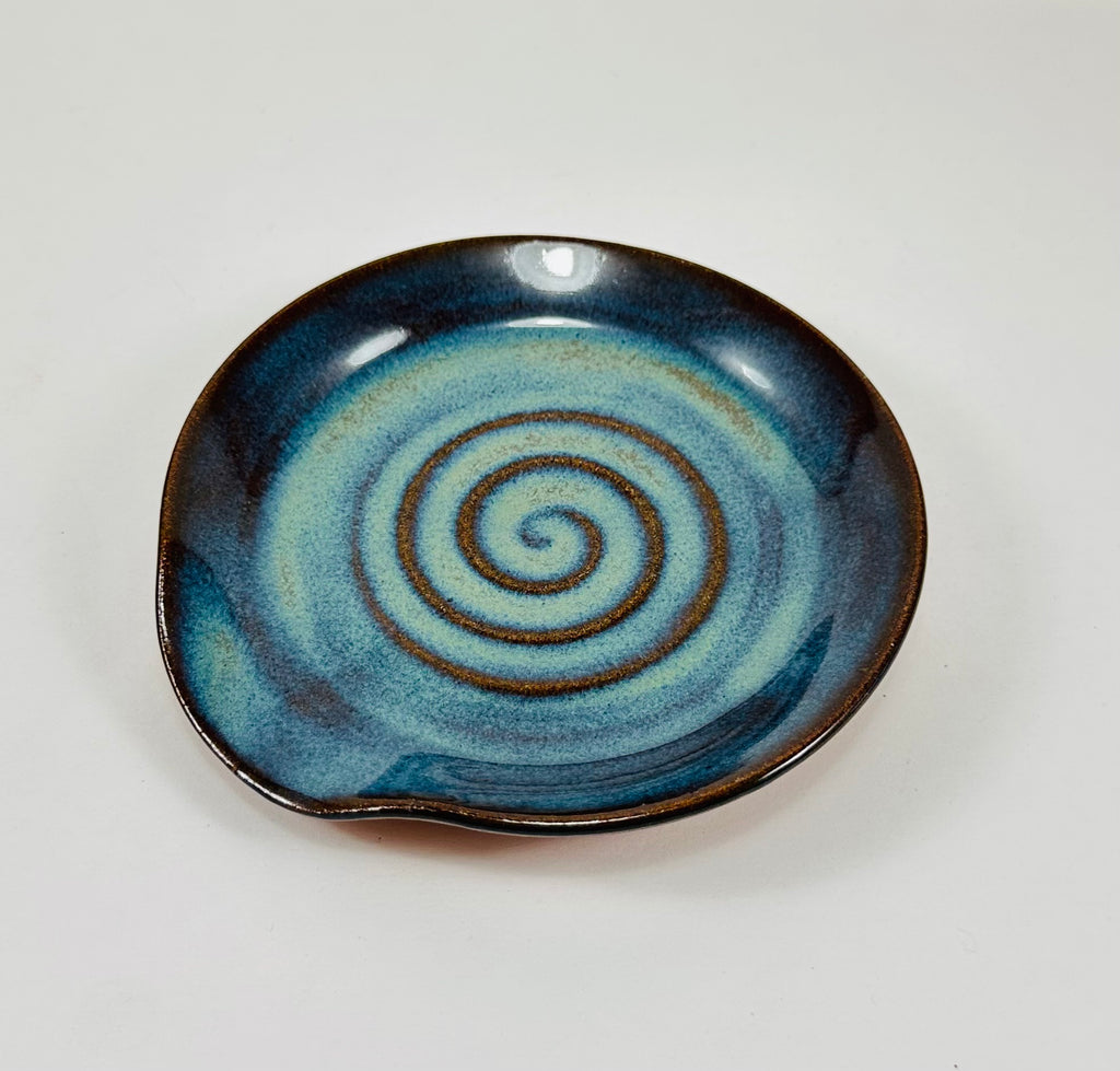Handmade spoon rest in a beautiful green and blue glaze.