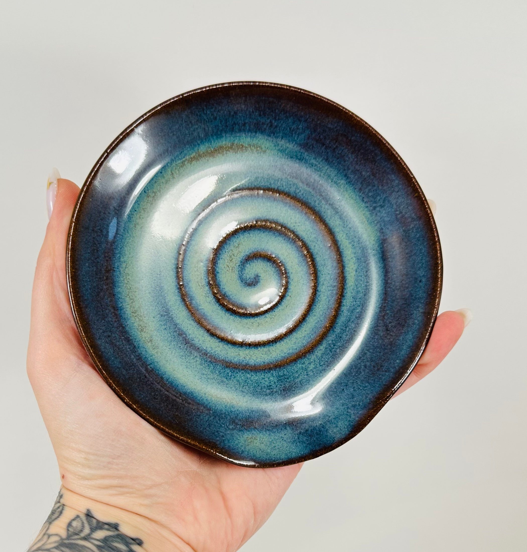 Handmade spoon rest in a beautiful green and blue glaze.