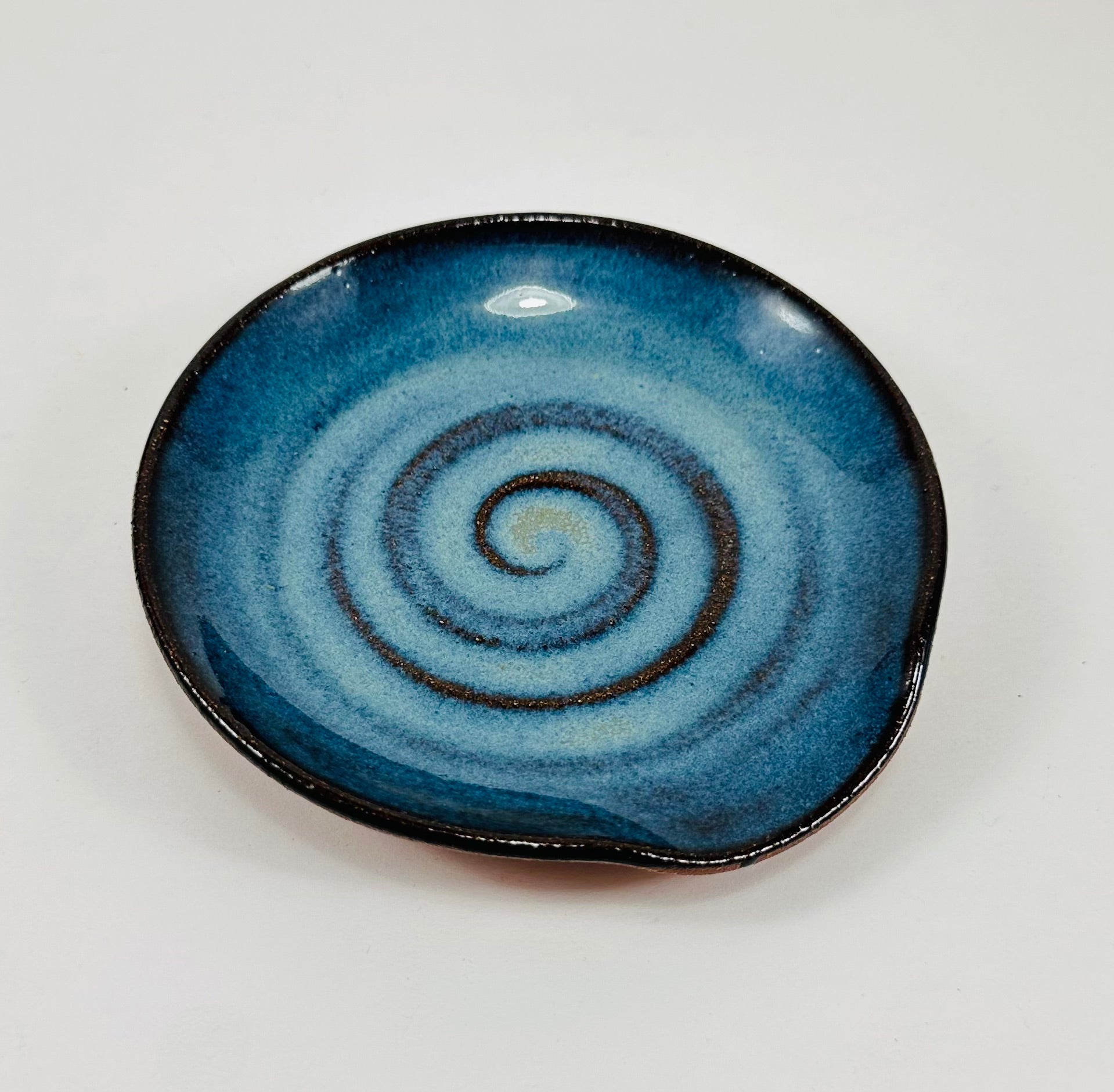 Handmade spoon rest in a beautiful blue glaze.