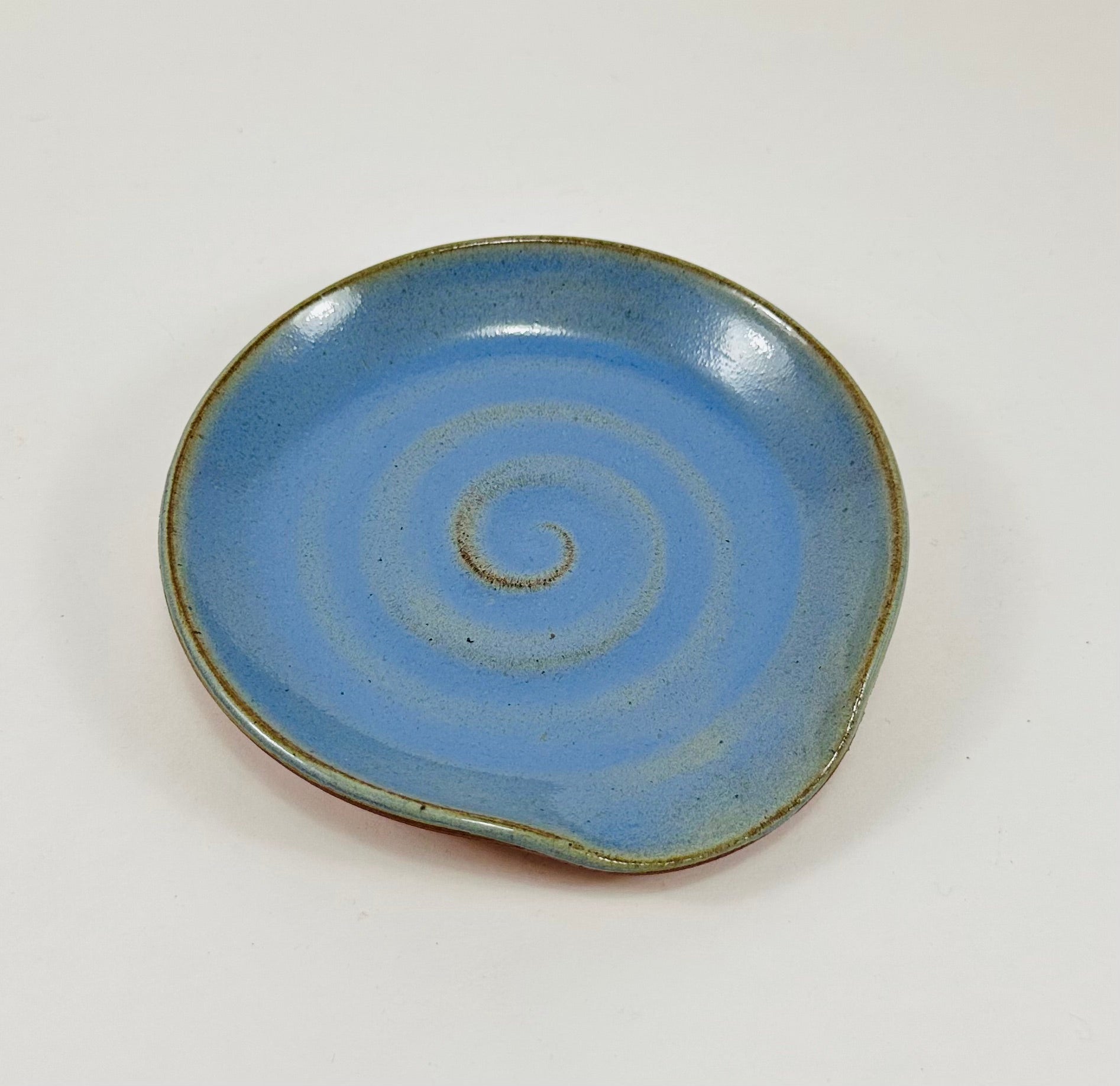 Handmade spoon rest in a beautiful blue glaze.