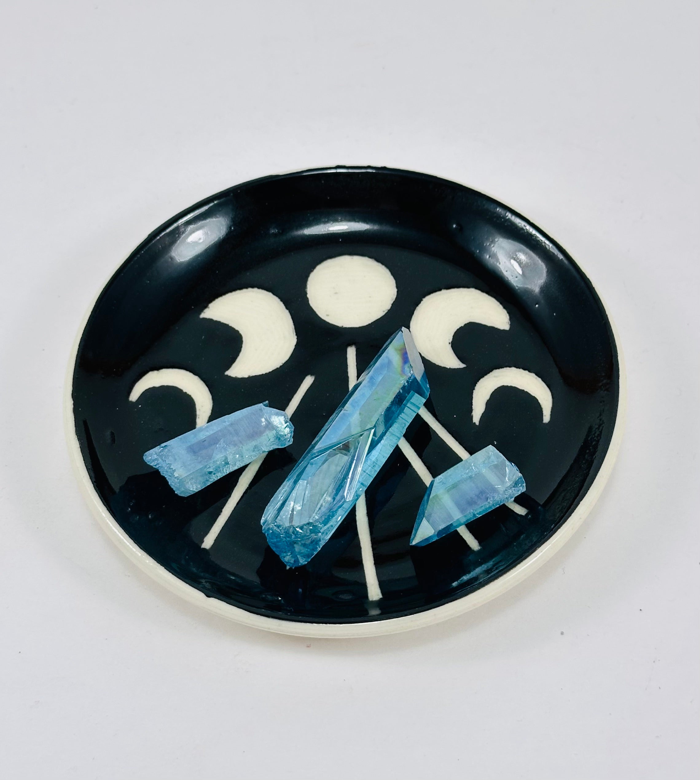 Handmade trinket dish in  black and white glaze with moons.