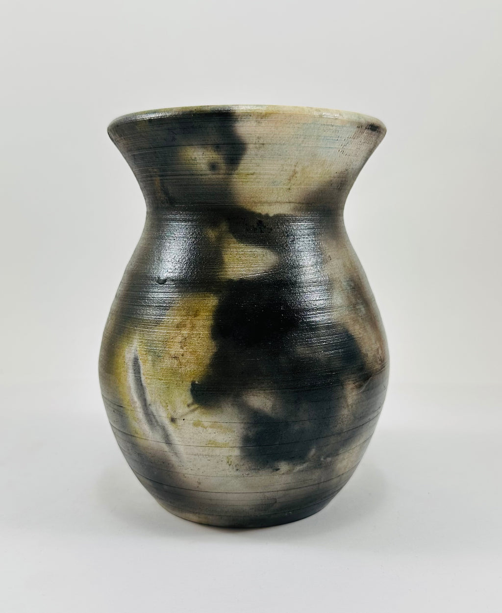 Handmade vase with a brown, white, black and yellow smokey finish.