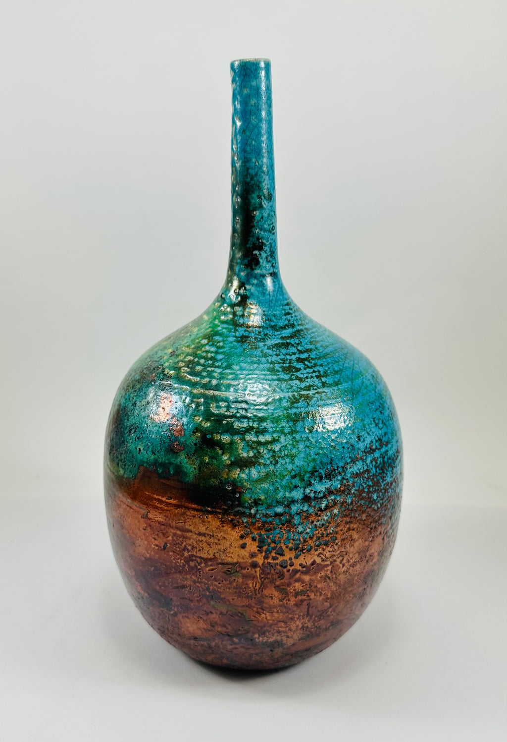 Handmade Raku vase in a beautiful turquoise and copper glaze.